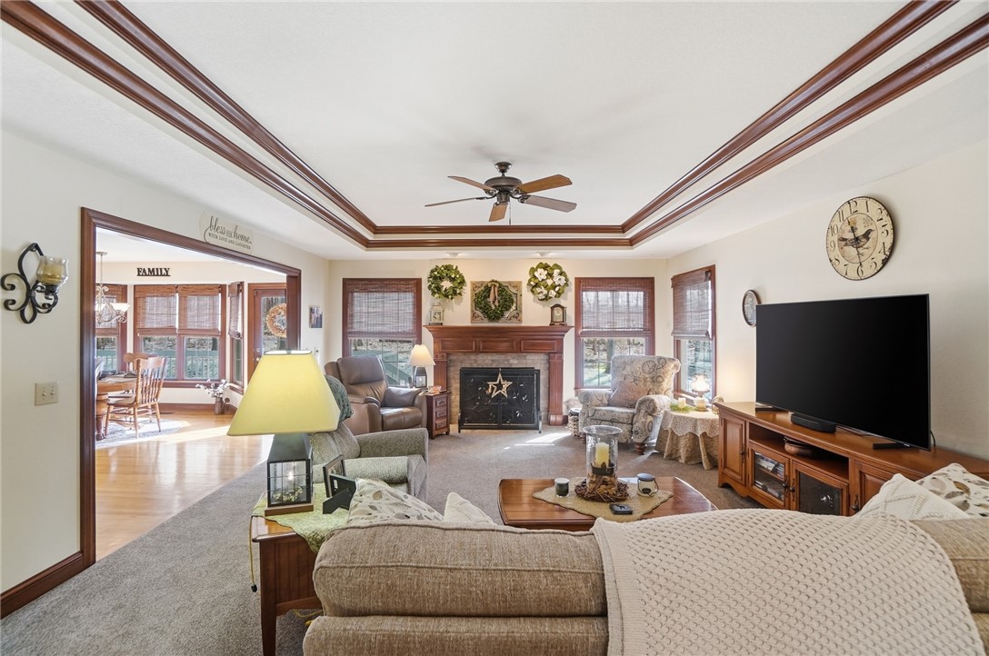 5300 Brookshire Lane Springfield, OH 45502 - Photo 8 of 56 This inviting living space features a cozy fireplace and elegant tray ceilings.