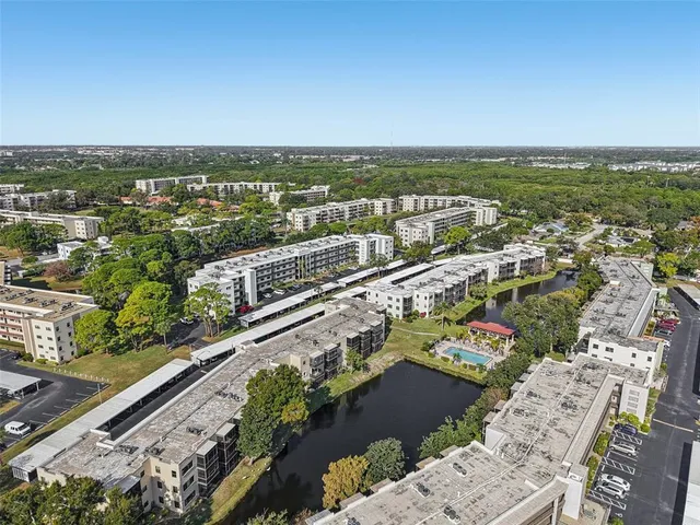 an aerial view of city and lake