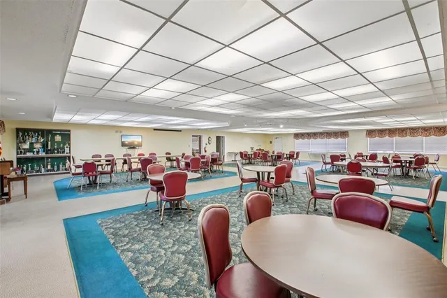 a room with lots of chairs and projector room