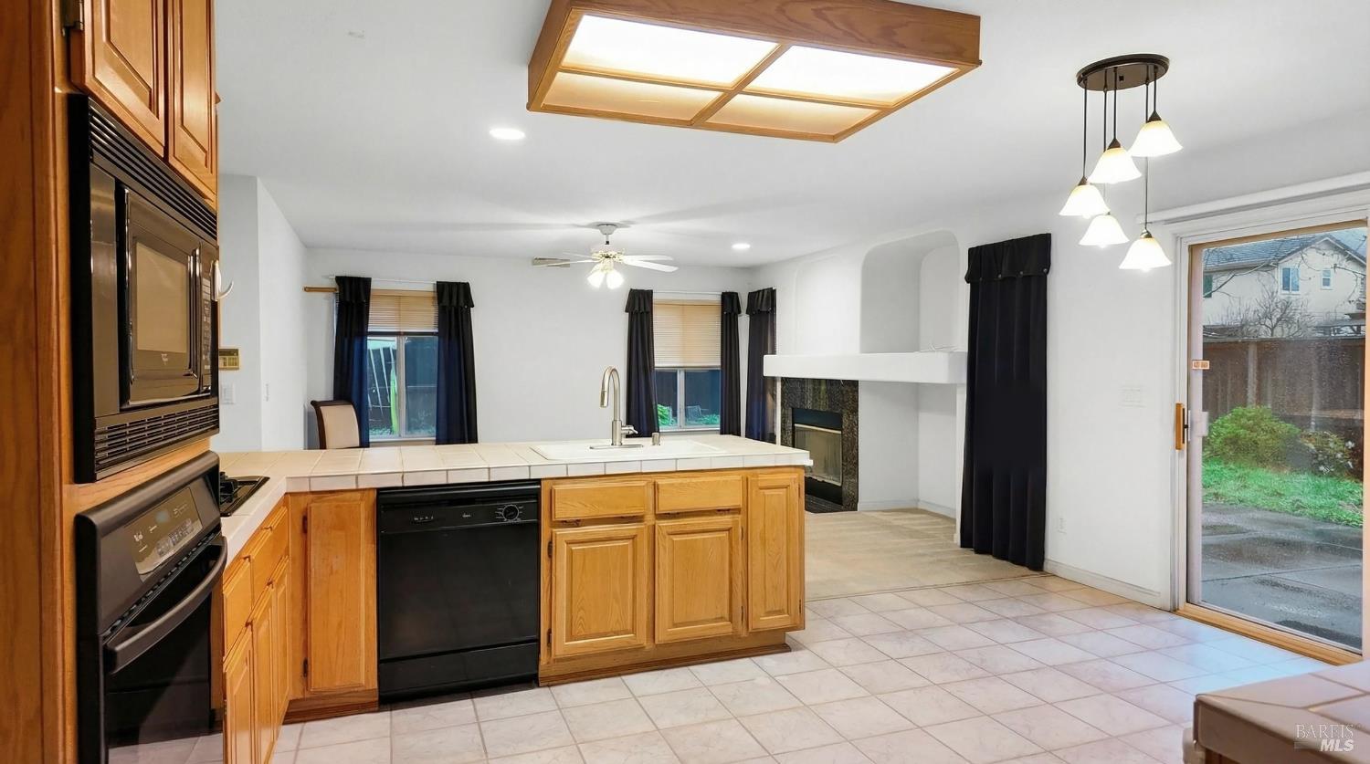 4124 Singletree Way Fairfield, CA 94533 - Photo 12 of 43 a kitchen that has a lot of cabinets in it