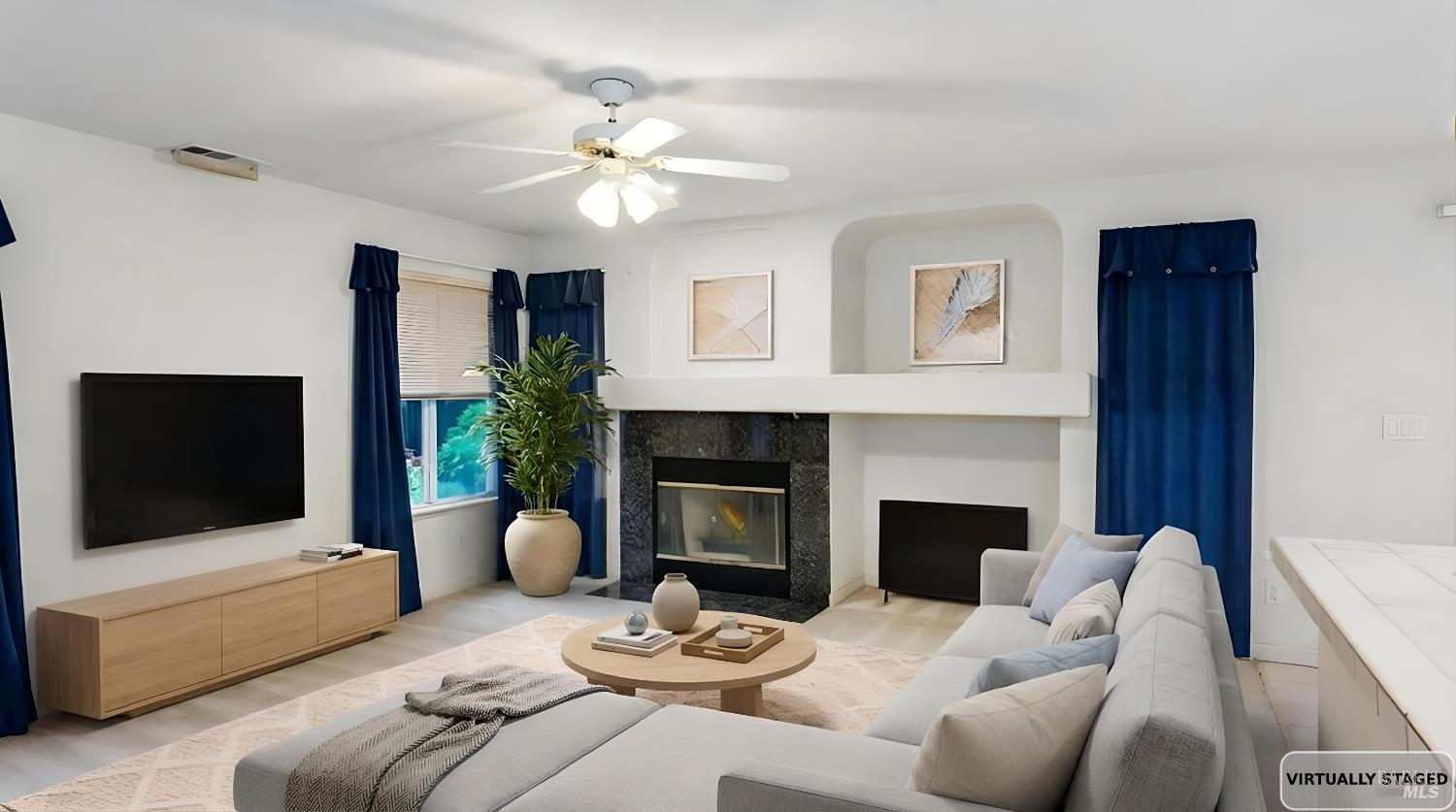 4124 Singletree Way Fairfield, CA 94533 - Photo 19 of 43 a living room with furniture a flat screen tv and a fireplace