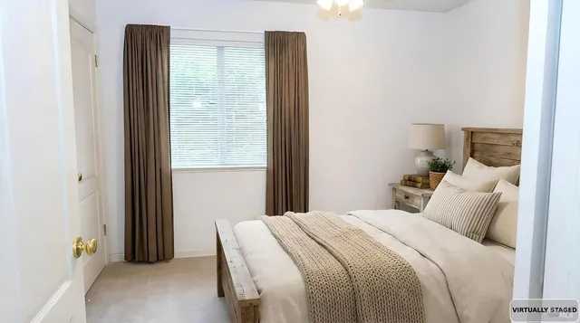 a bathroom with a sink a toilet a mirror and shower