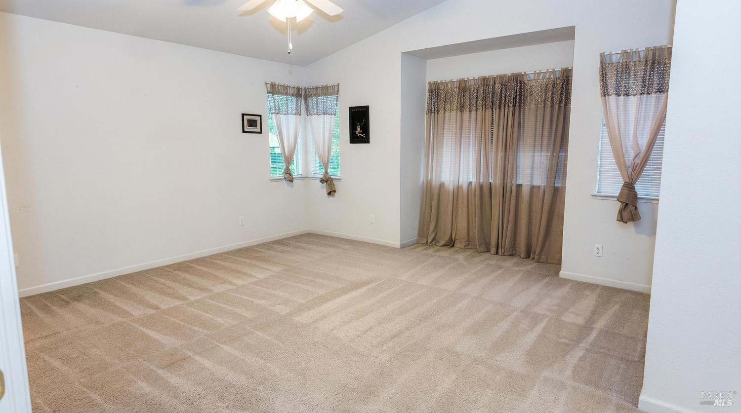 4124 Singletree Way Fairfield, CA 94533 - Photo 30 of 43 an empty room with windows and closet