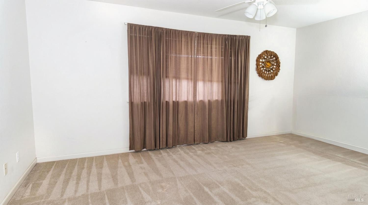 4124 Singletree Way Fairfield, CA 94533 - Photo 35 of 43 an empty room with windows and closet