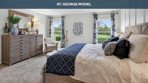 a bedroom with a bed and a table in it