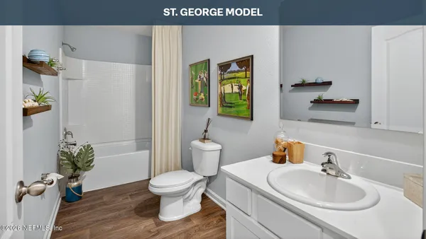 a open kitchen with cabinets a sink and wooden floor