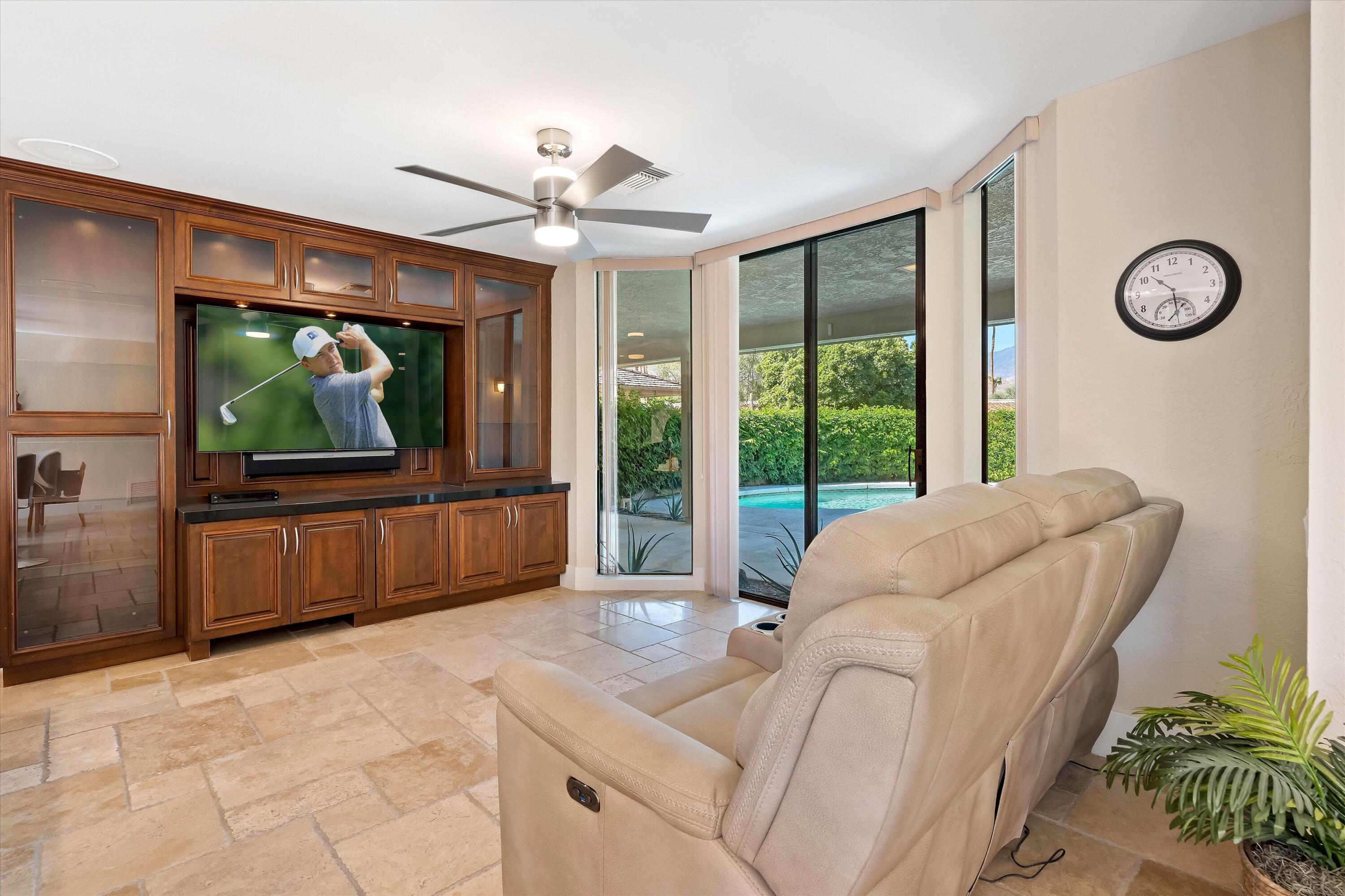 62 Dartmouth Drive Rancho Mirage, CA 92270 - Photo 12 of 46 a living room with furniture tv and a large window