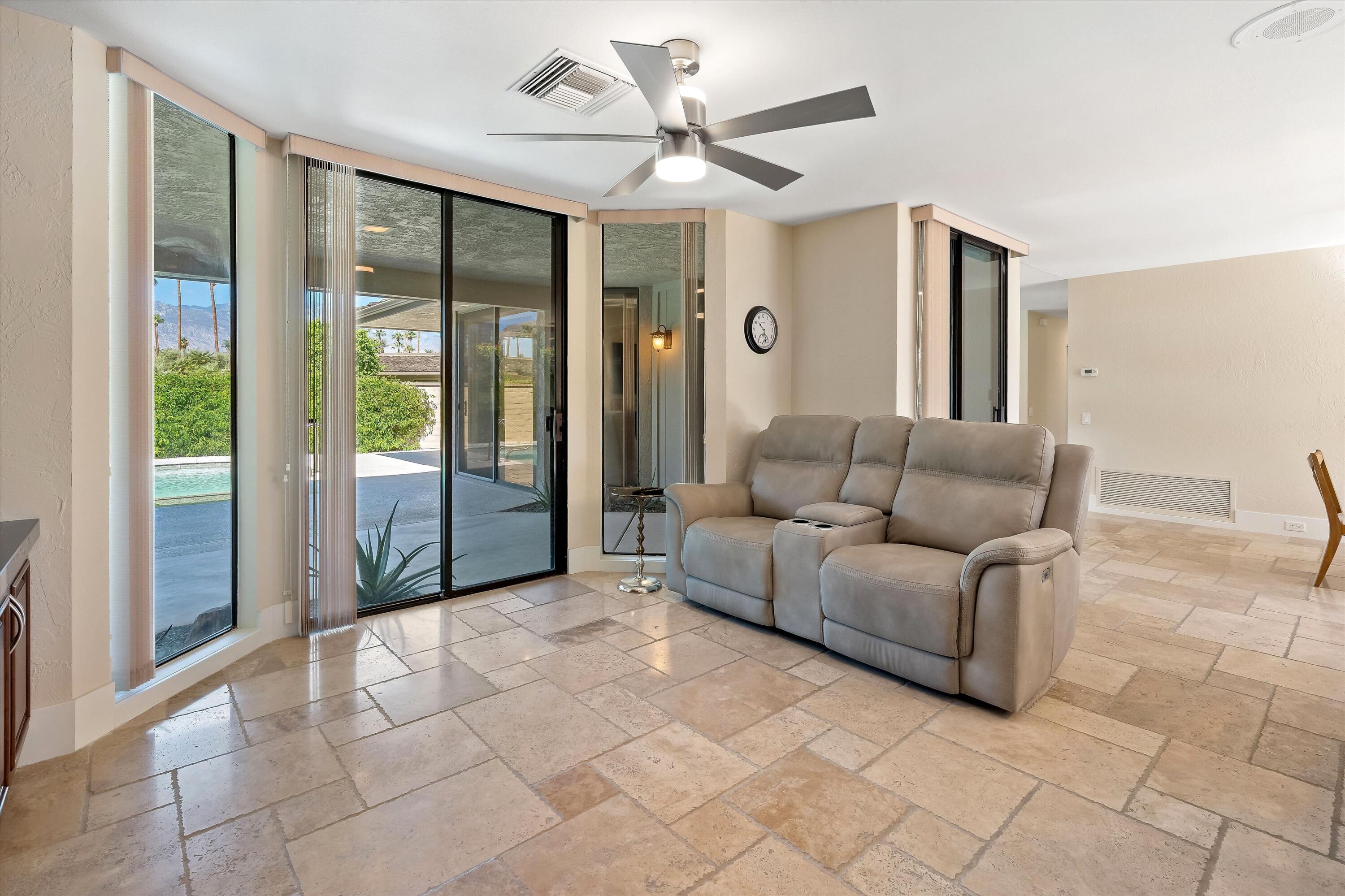 62 Dartmouth Drive Rancho Mirage, CA 92270 - Photo 13 of 46 a living room with furniture and large windows
