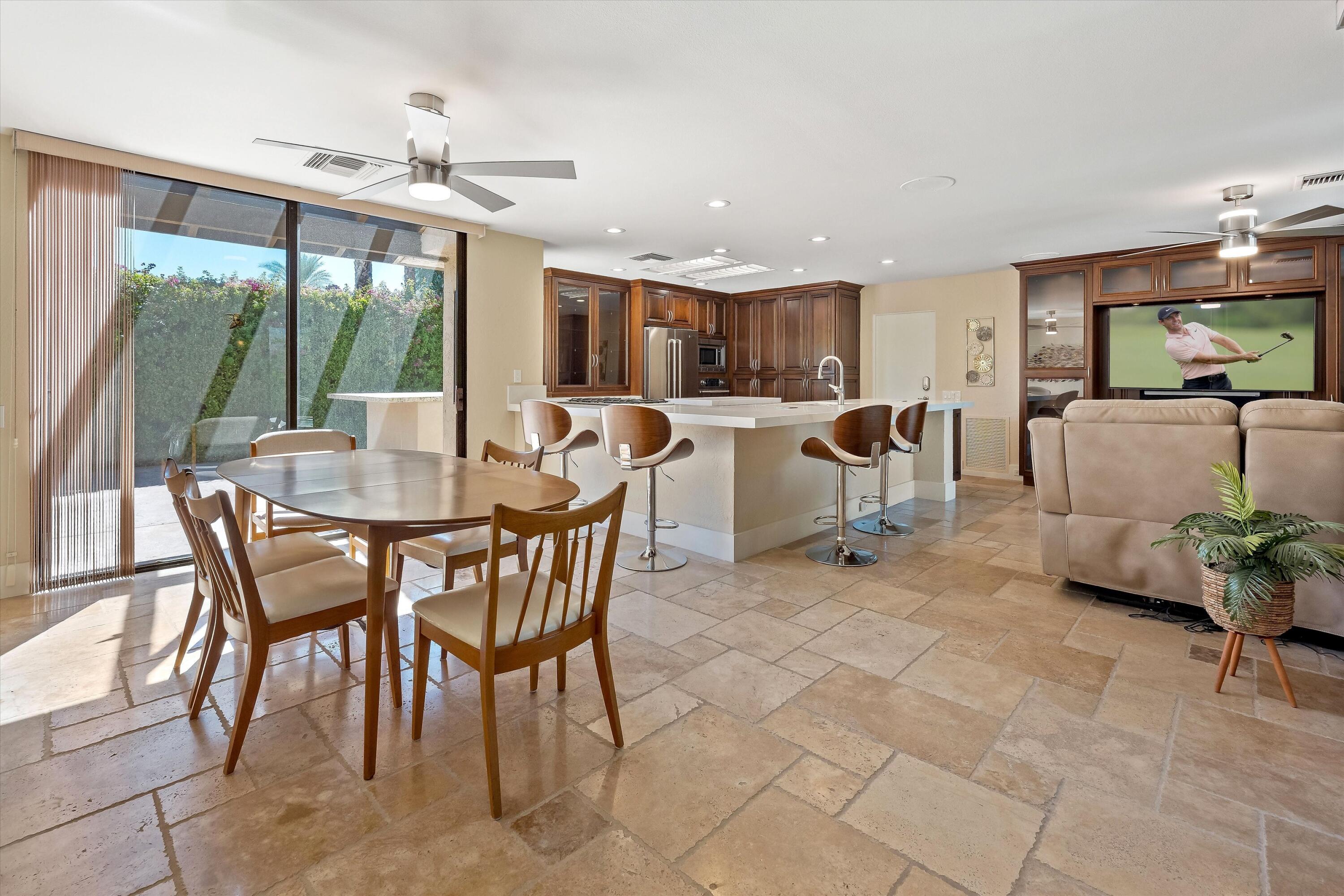 62 Dartmouth Drive Rancho Mirage, CA 92270 - Photo 14 of 46 a view of a dining room with furniture window and outside view