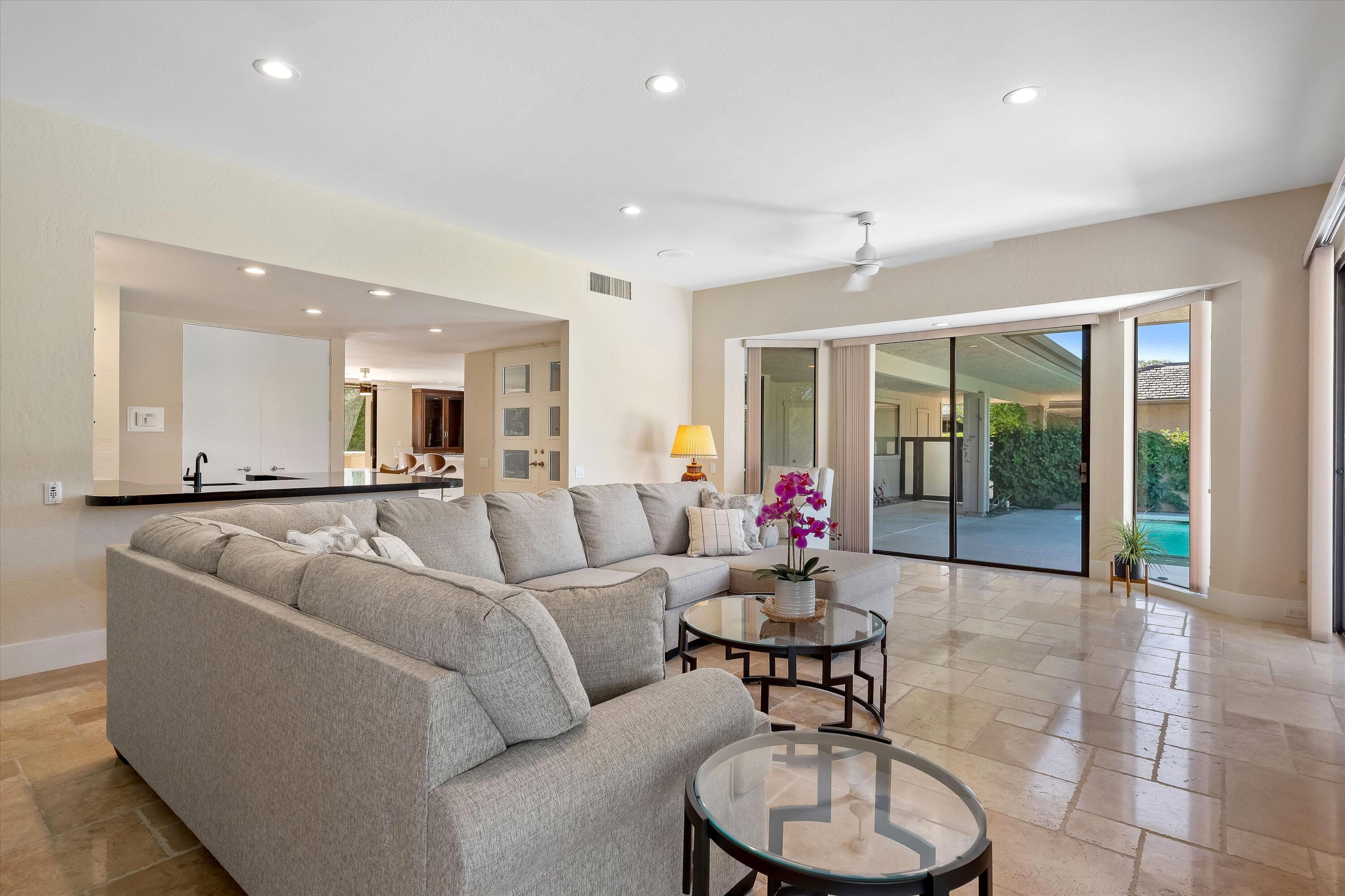 62 Dartmouth Drive Rancho Mirage, CA 92270 - Photo 18 of 46 a living room with furniture and a potted plant
