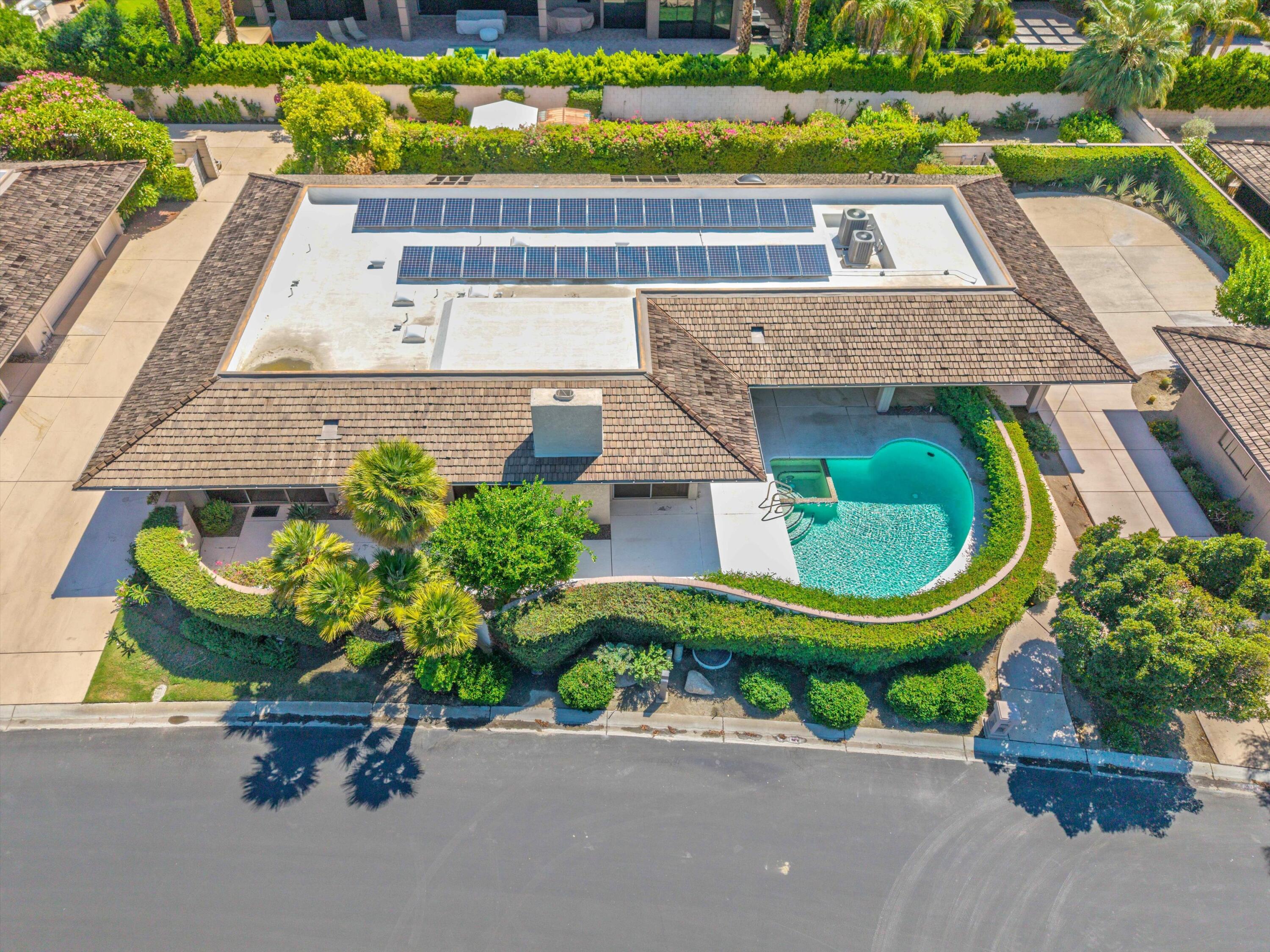 62 Dartmouth Drive Rancho Mirage, CA 92270 - Photo 2 of 46 an aerial view of a house with a garden and plants
