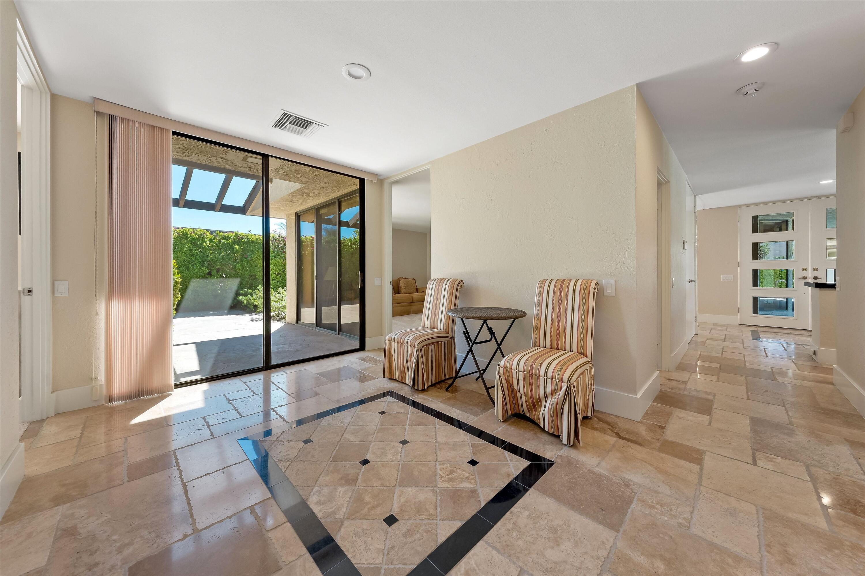 62 Dartmouth Drive Rancho Mirage, CA 92270 - Photo 22 of 46 a living room with furniture and a large window