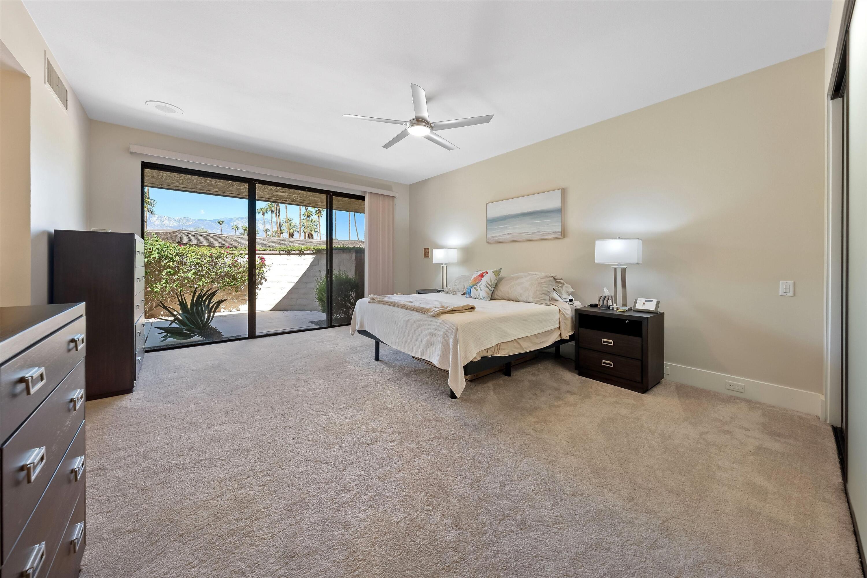 62 Dartmouth Drive Rancho Mirage, CA 92270 - Photo 24 of 46 a spacious bedroom with a large bed and a large window