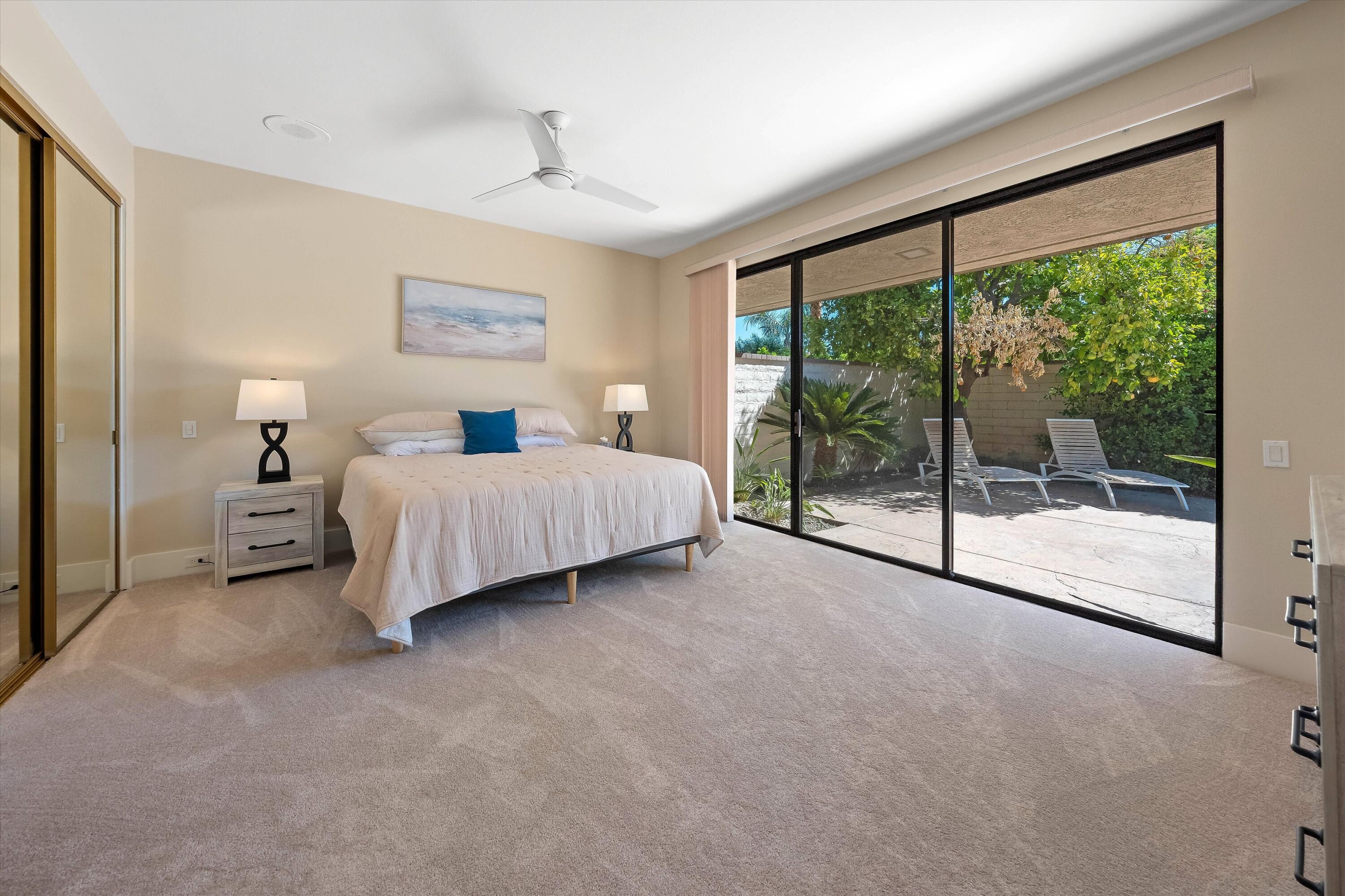 62 Dartmouth Drive Rancho Mirage, CA 92270 - Photo 29 of 46 a spacious bedroom with a bed and a large window