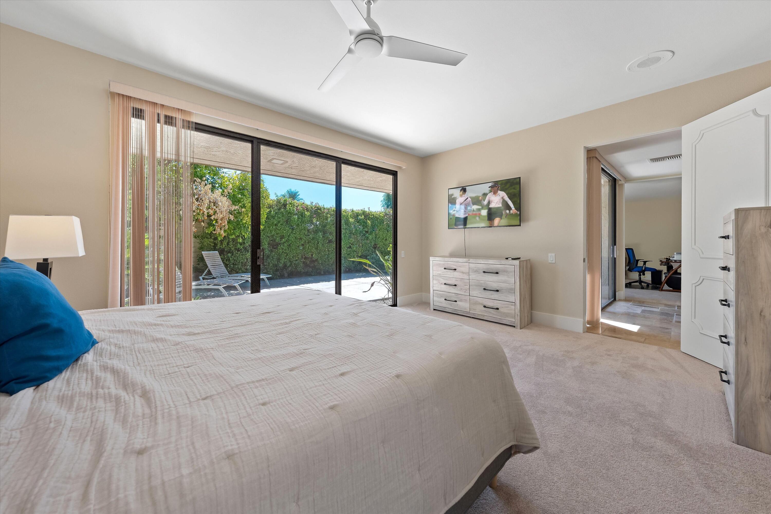 62 Dartmouth Drive Rancho Mirage, CA 92270 - Photo 30 of 46 a spacious bedroom with a large bed and a large window