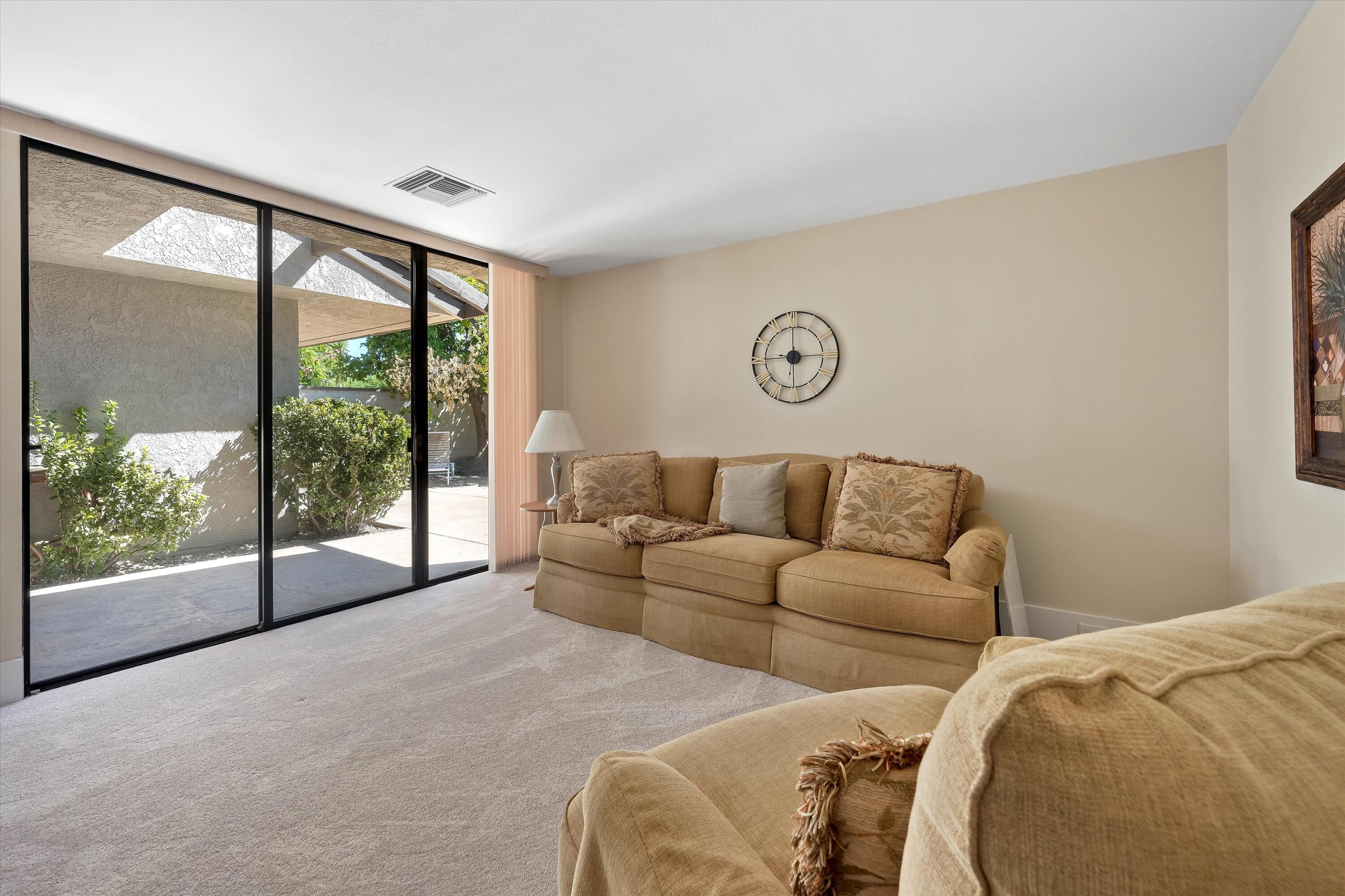62 Dartmouth Drive Rancho Mirage, CA 92270 - Photo 34 of 46 a living room with a large window with outer view