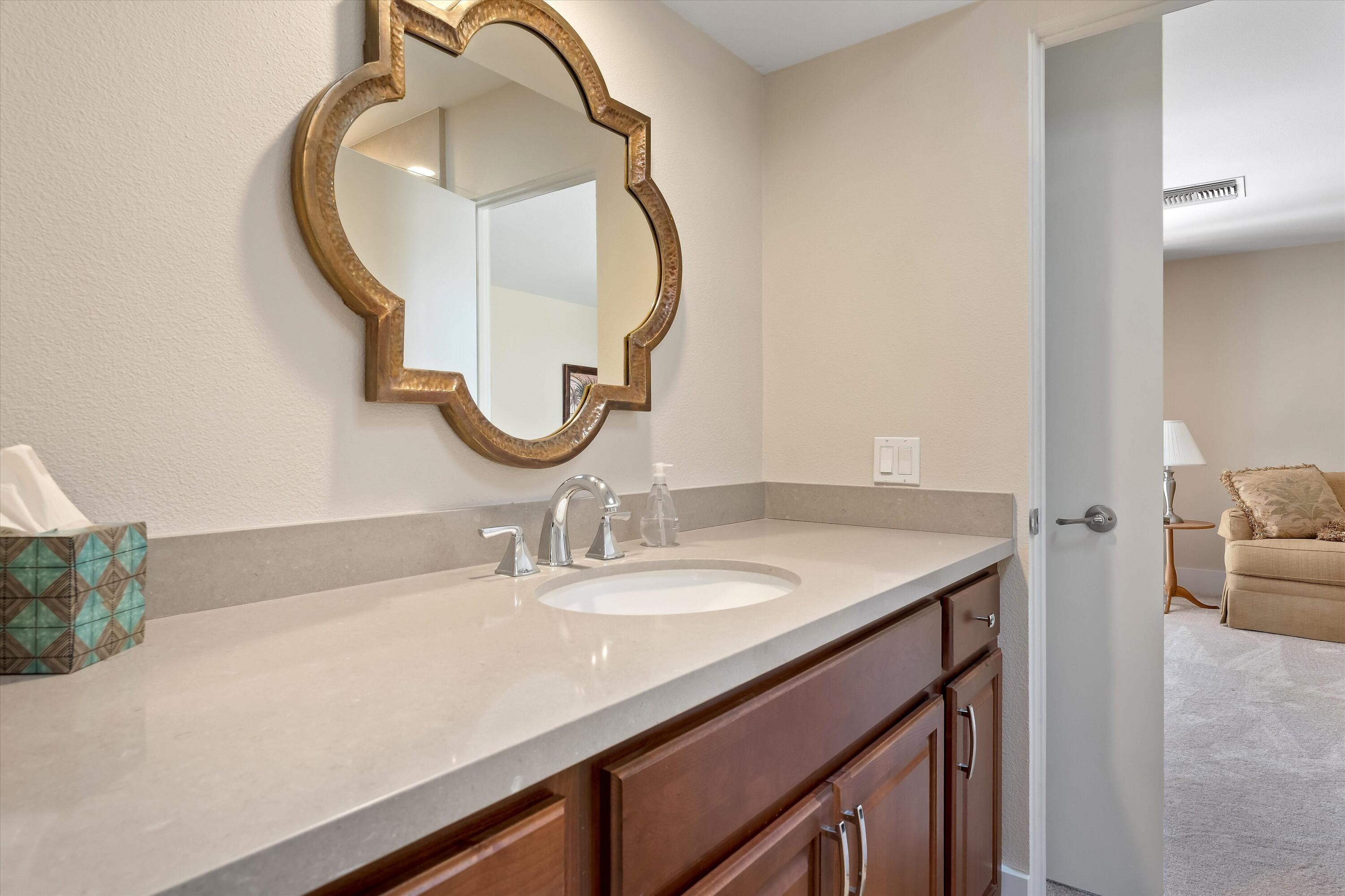 62 Dartmouth Drive Rancho Mirage, CA 92270 - Photo 35 of 46 a bathroom with a sink and a mirror