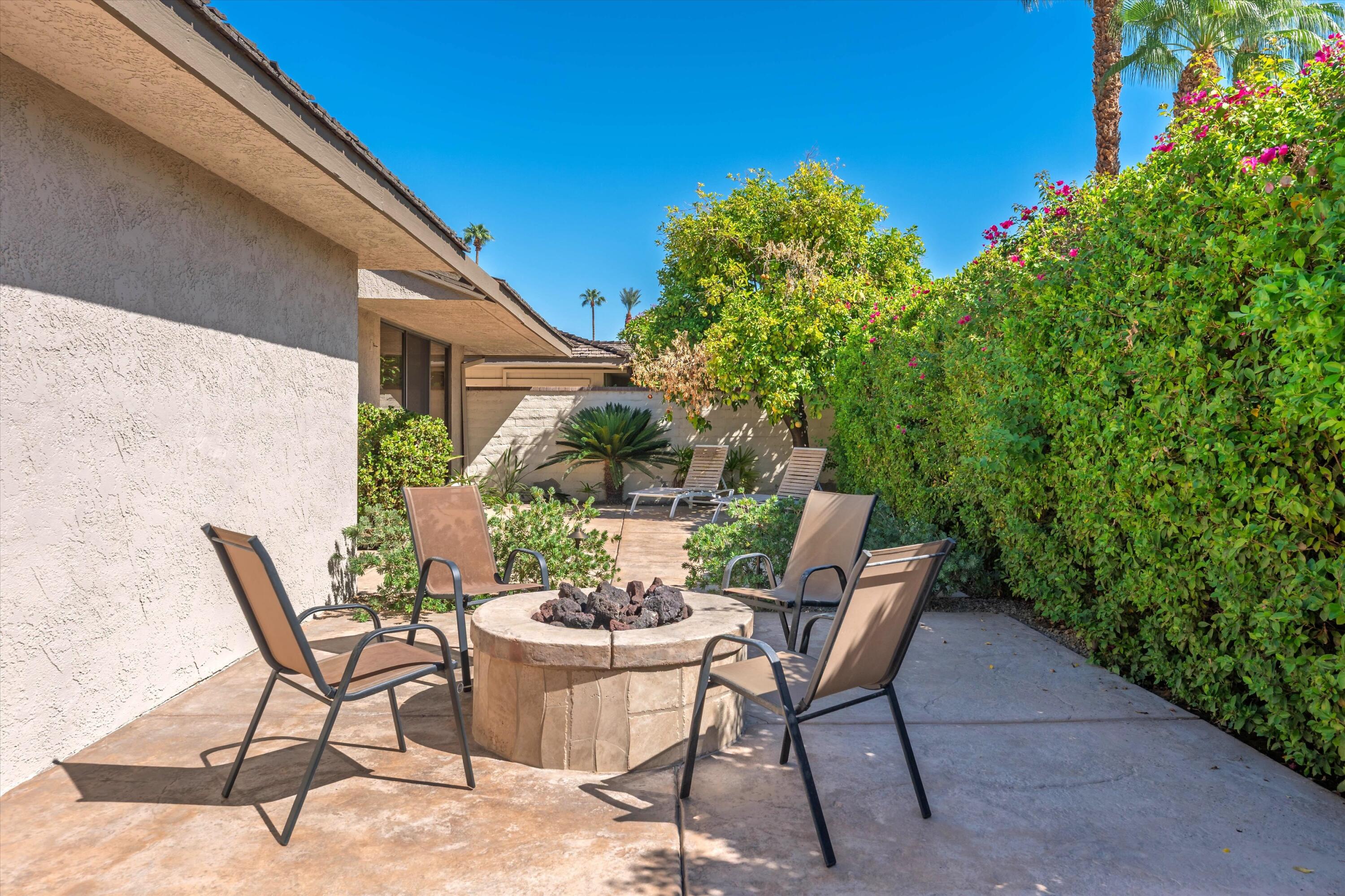 62 Dartmouth Drive Rancho Mirage, CA 92270 - Photo 38 of 46 a view of backyard of house with seating space