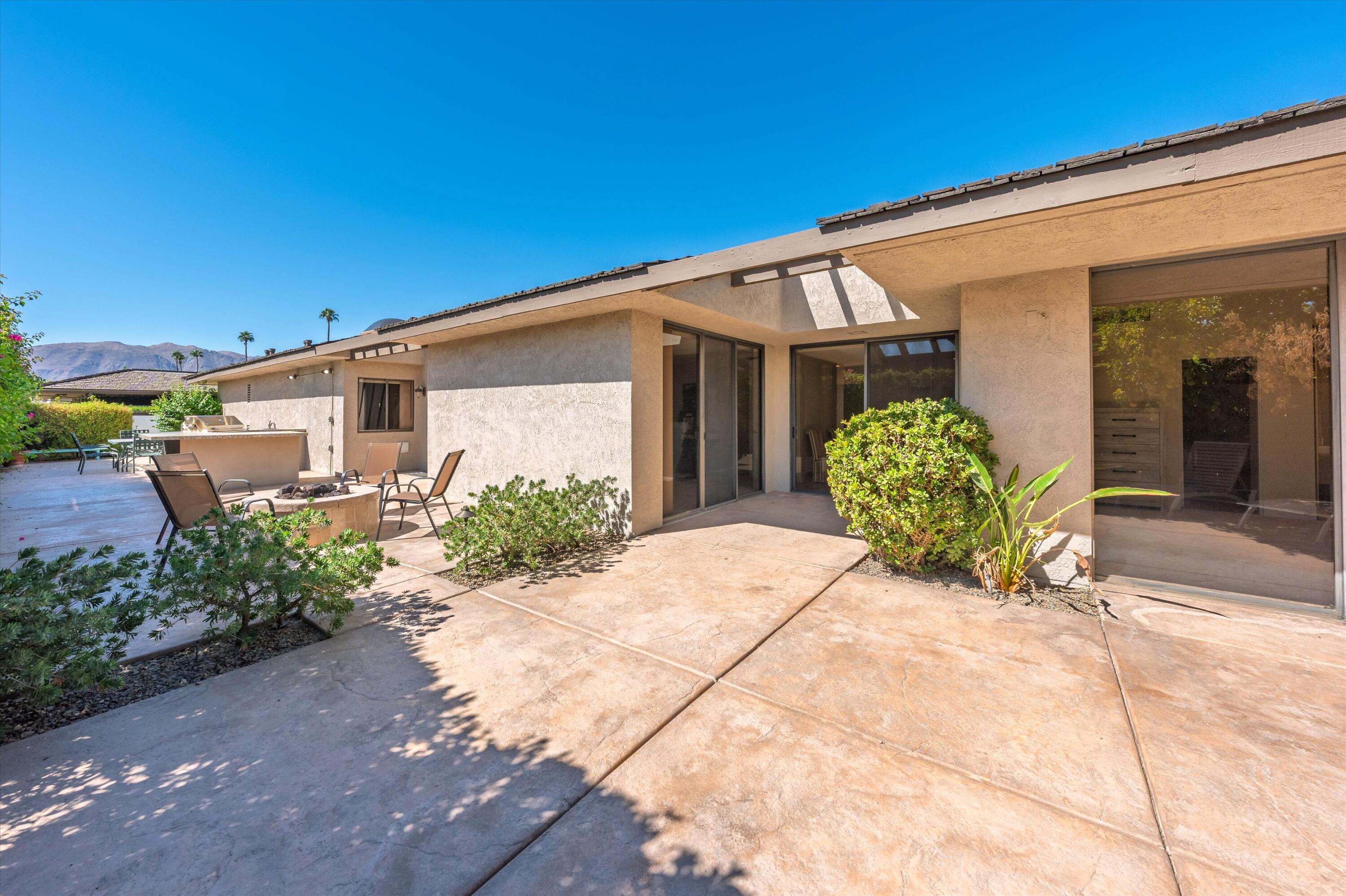 62 Dartmouth Drive Rancho Mirage, CA 92270 - Photo 40 of 46 a view of a house with a yard