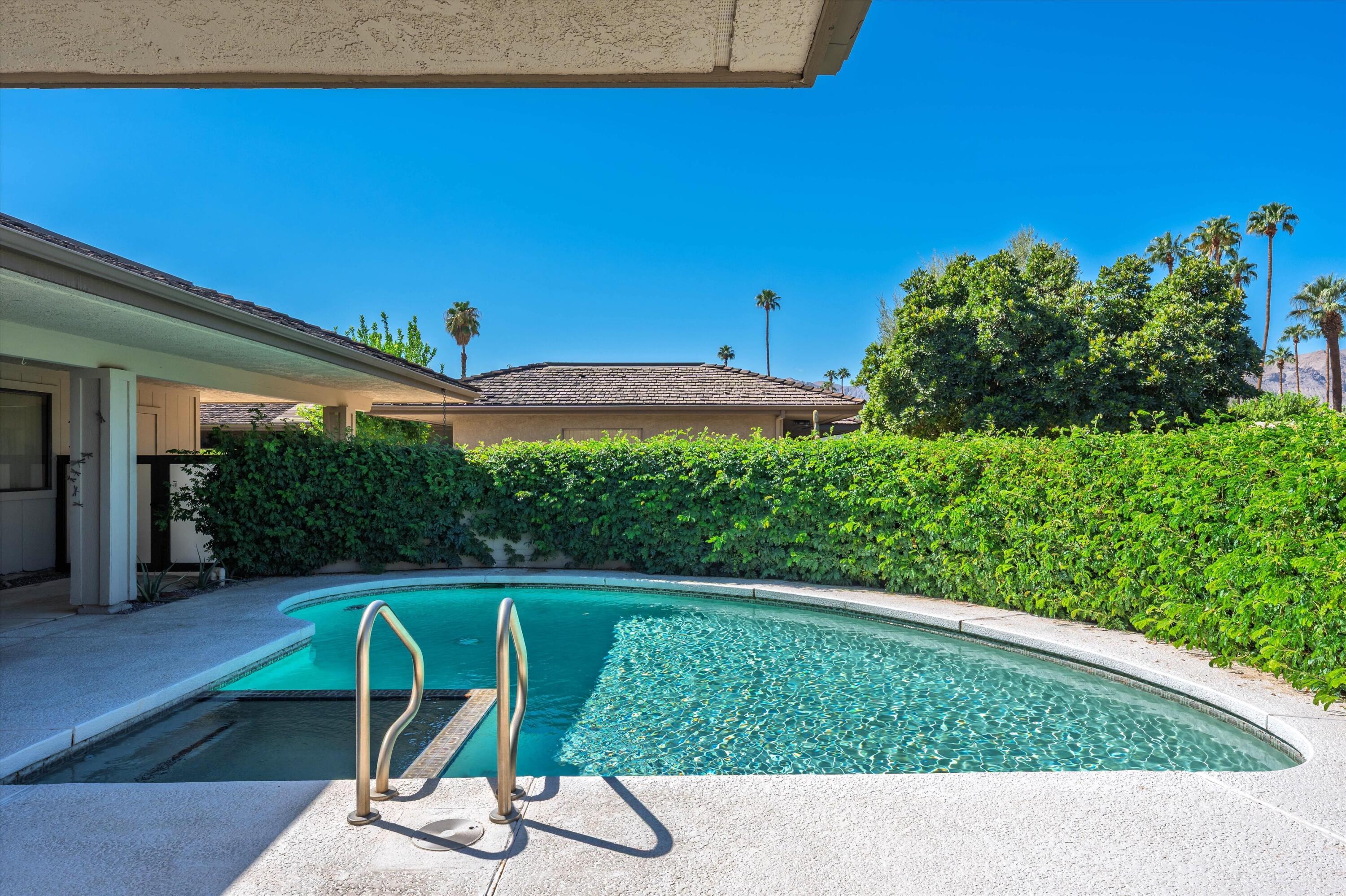 62 Dartmouth Drive Rancho Mirage, CA 92270 - Photo 6 of 46 a view of a swimming pool with a patio