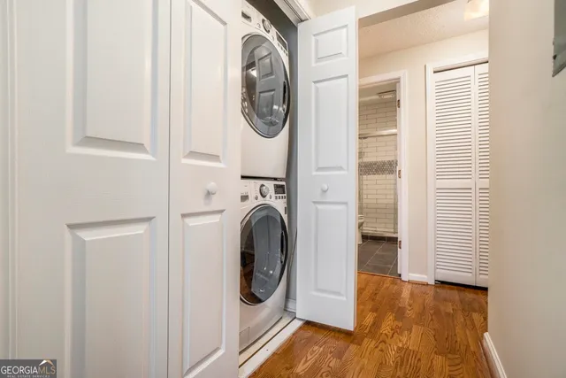 a view of a hallway with washer and dryer