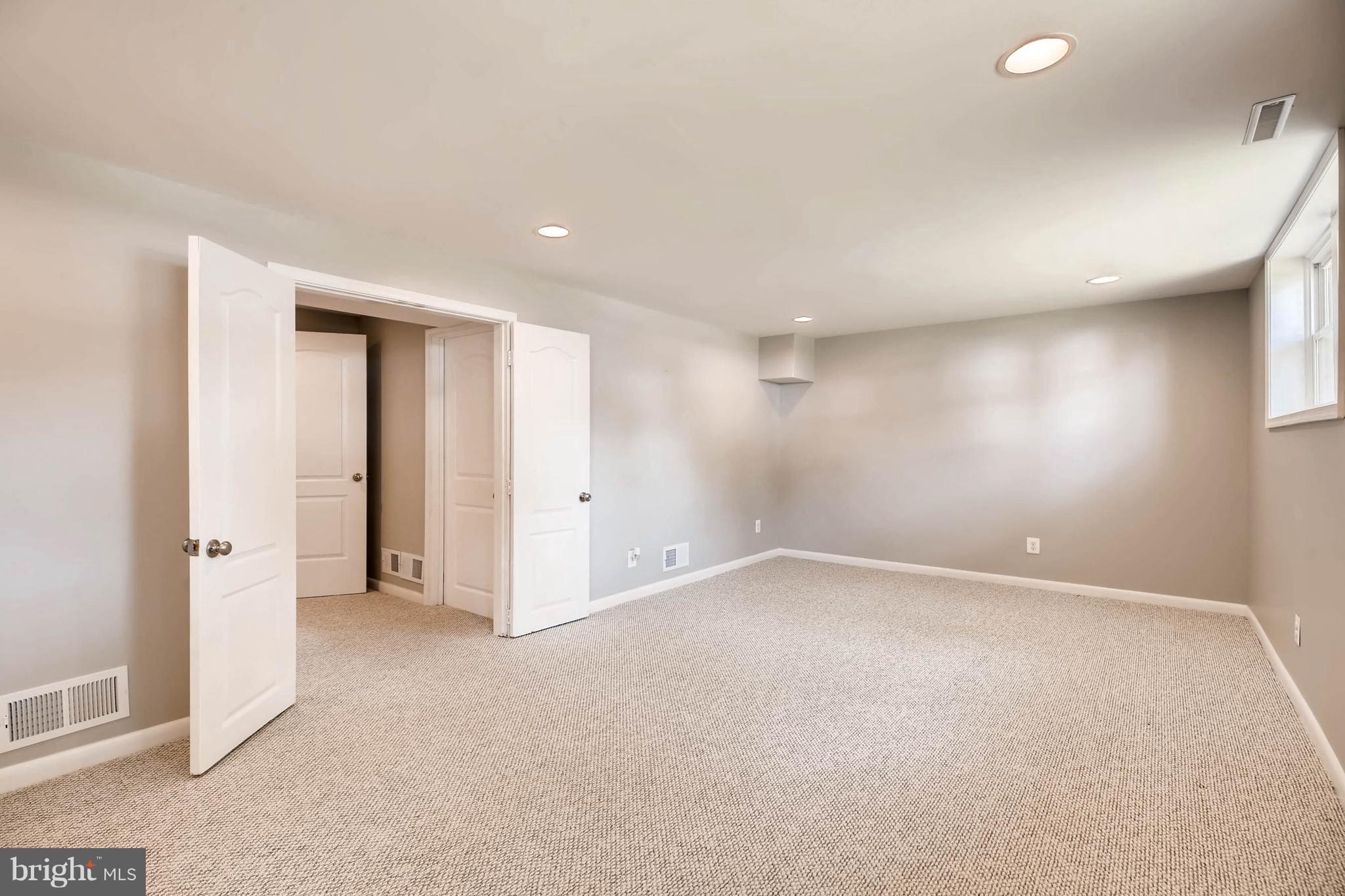 9020 Hamor Road Randallstown, MD 21133 - Photo 20 of 24 an empty room with a natural light