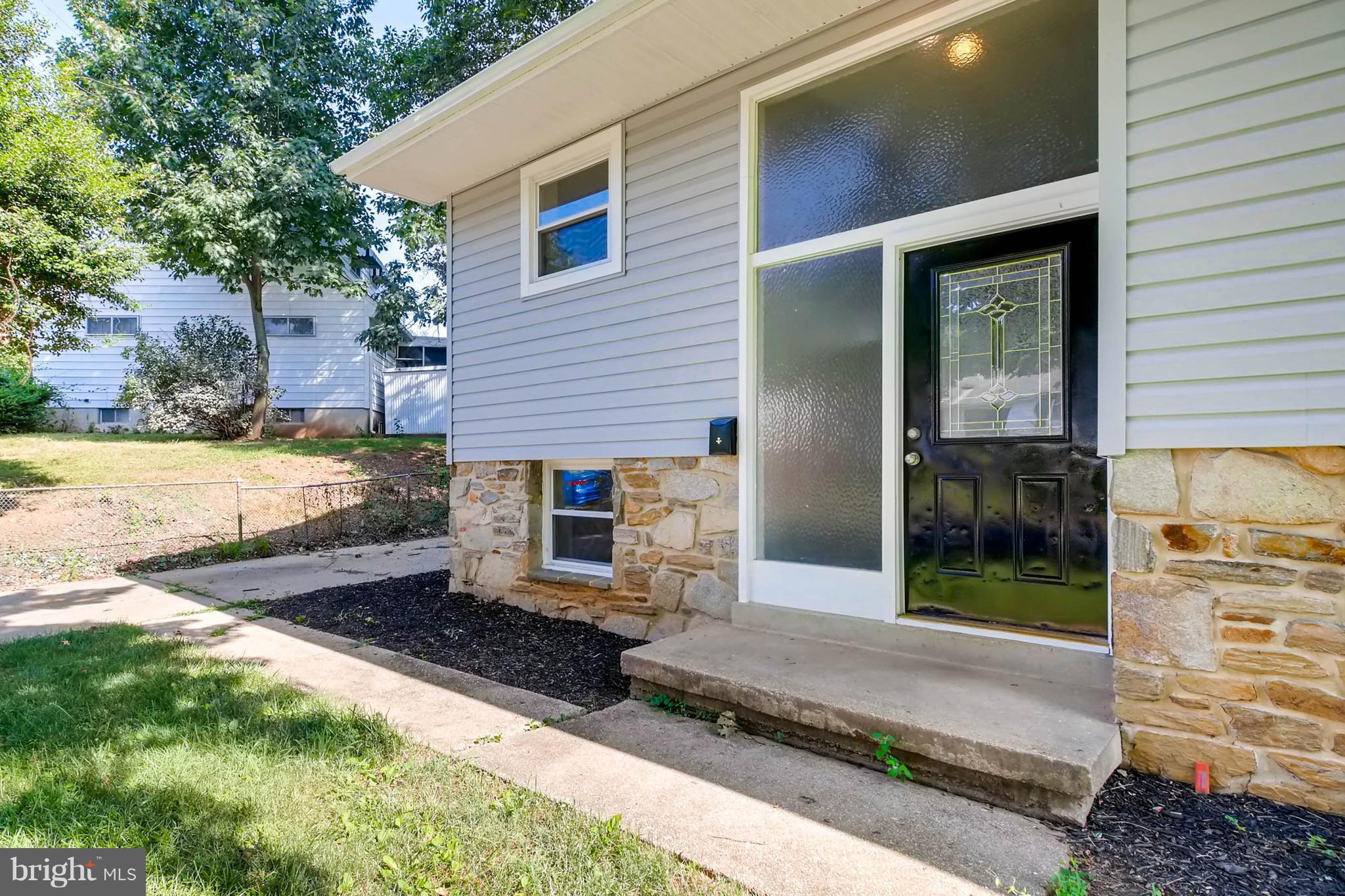 9020 Hamor Road Randallstown, MD 21133 - Photo 3 of 24 a front view of a house with a yard