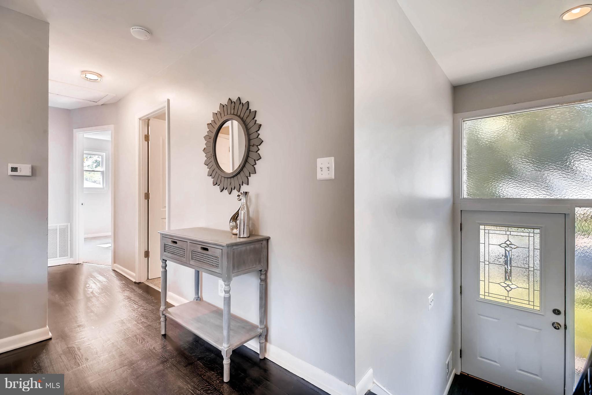 9020 Hamor Road Randallstown, MD 21133 - Photo 4 of 24 a view of a room with wooden floor and furniture