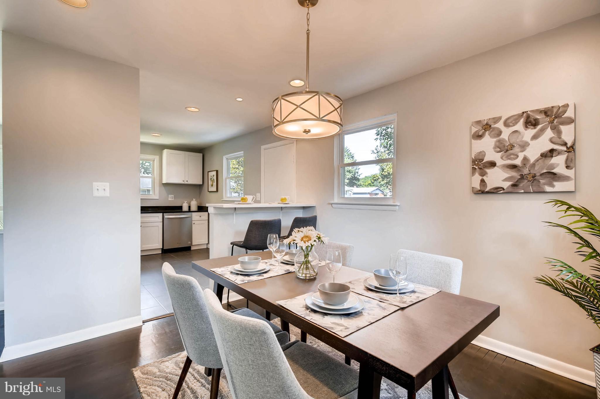 9020 Hamor Road Randallstown, MD 21133 - Photo 7 of 24 a view of a dining room with furniture window and wooden floor
