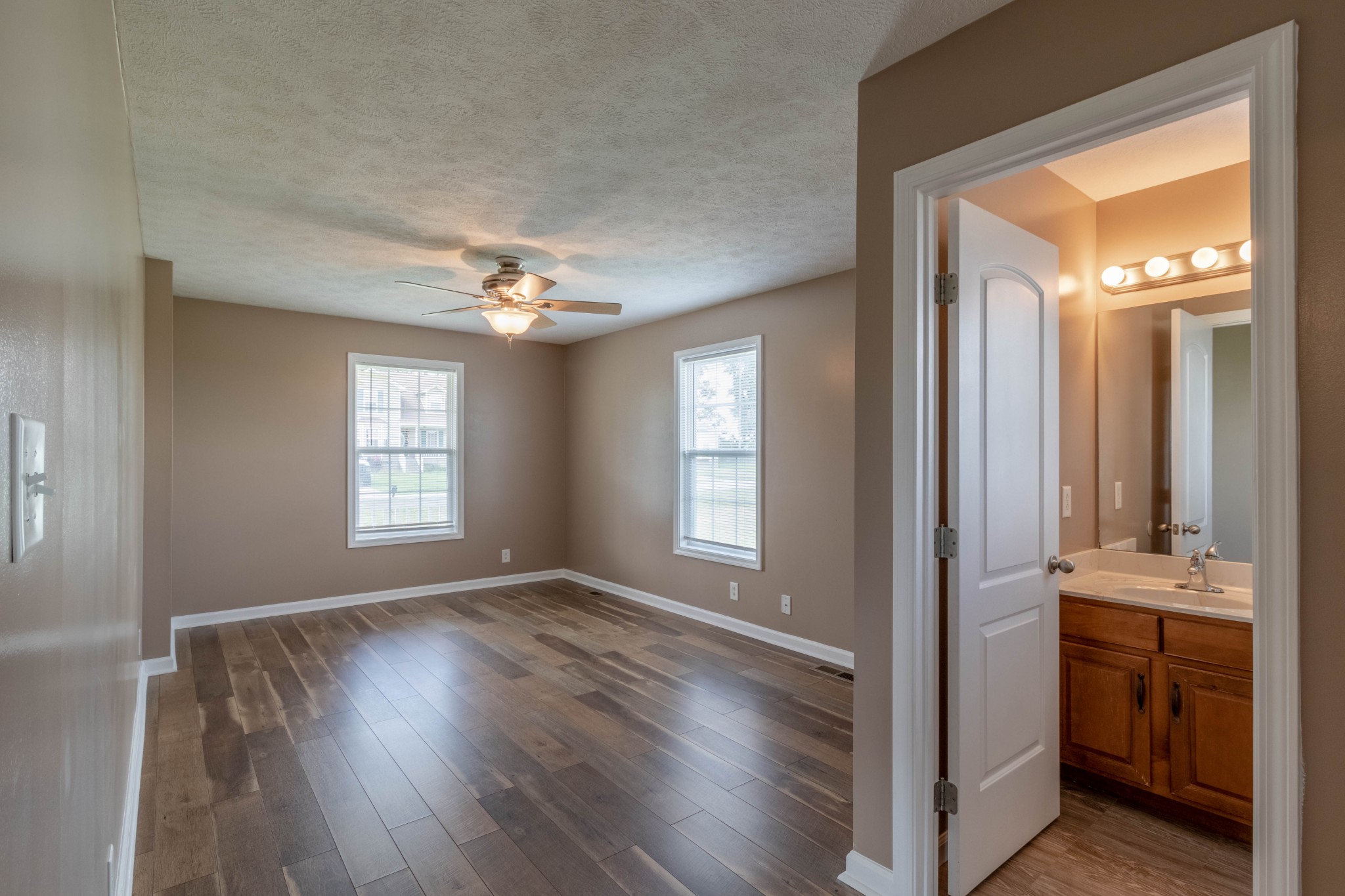11241 Bell Station Road Oak Grove, KY 42262 - Photo 16 of 33 a view of livingroom with hardwood floor and a ceiling fan