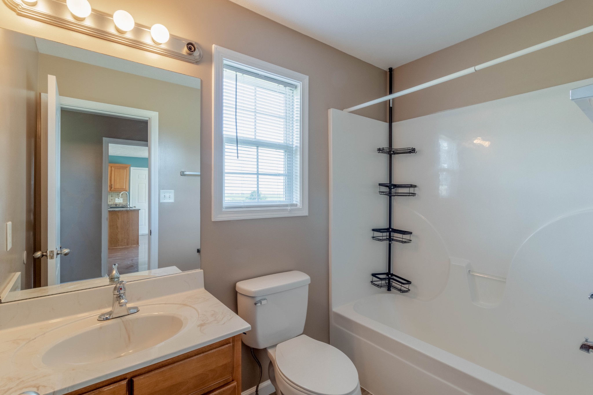 11241 Bell Station Road Oak Grove, KY 42262 - Photo 18 of 33 a bathroom with a sink toilet and shower