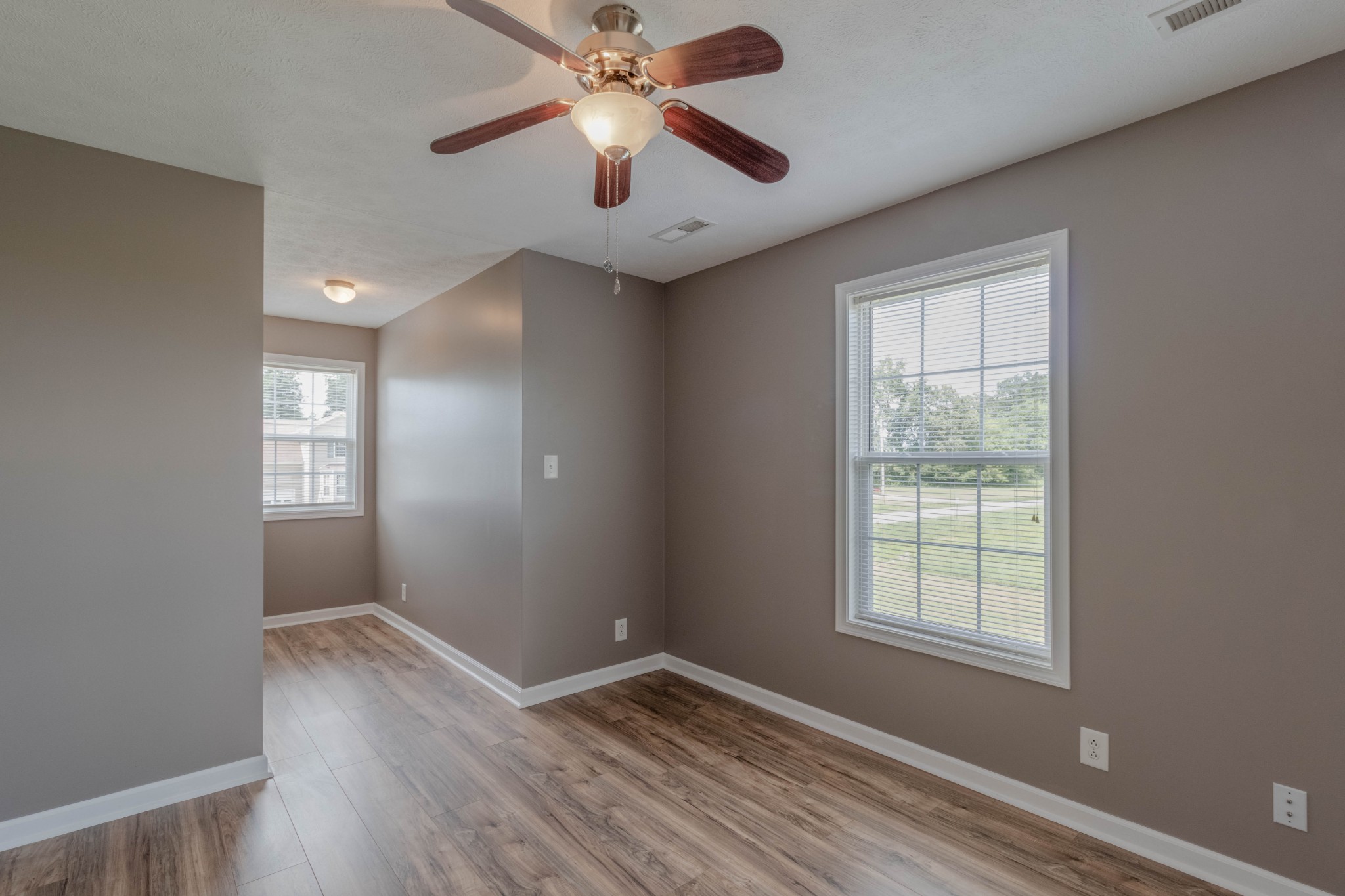11241 Bell Station Road Oak Grove, KY 42262 - Photo 19 of 33 wooden floor in an empty room with a window