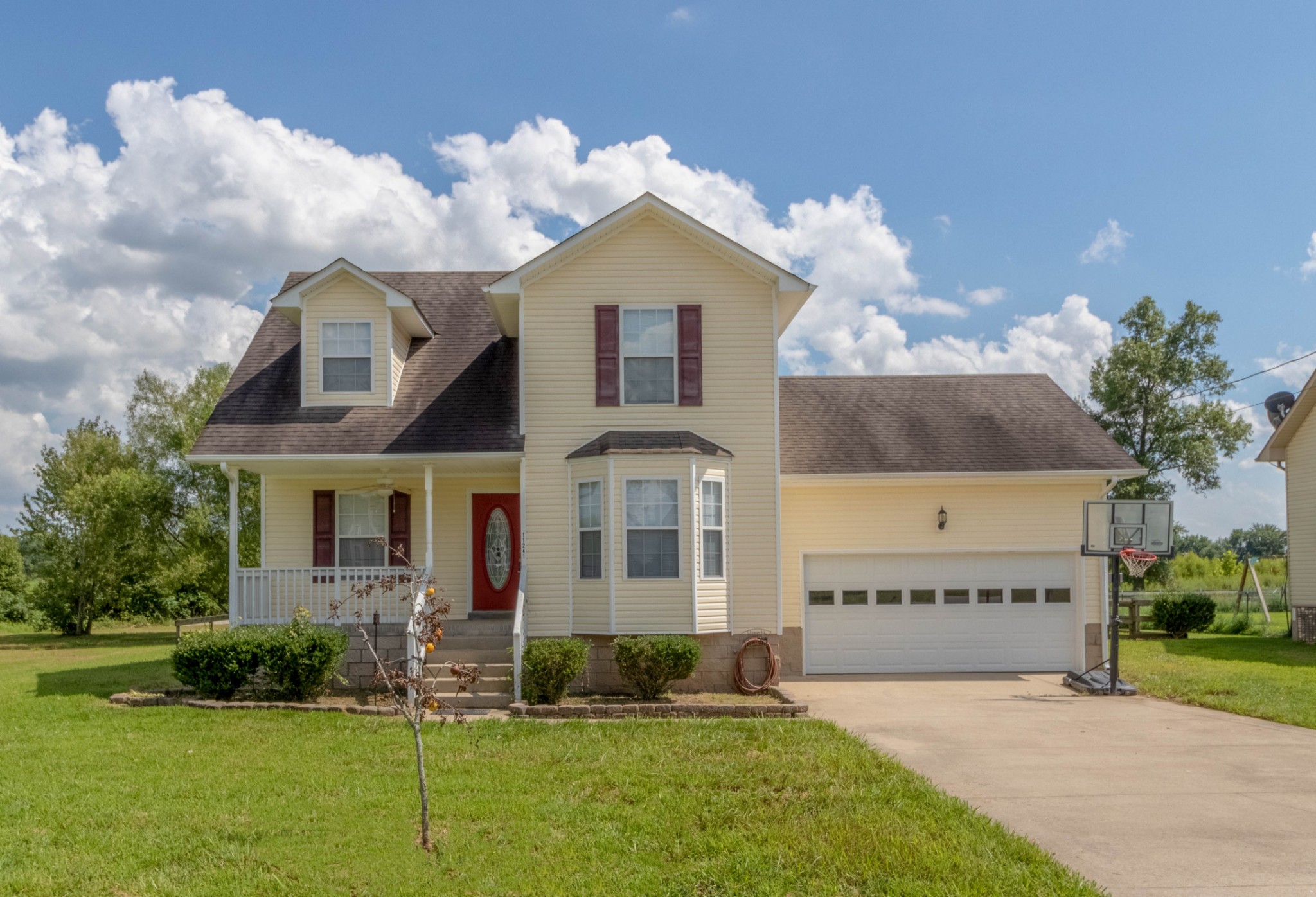 11241 Bell Station Road Oak Grove, KY 42262 - Photo 2 of 33 a front view of a house with a yard and garage