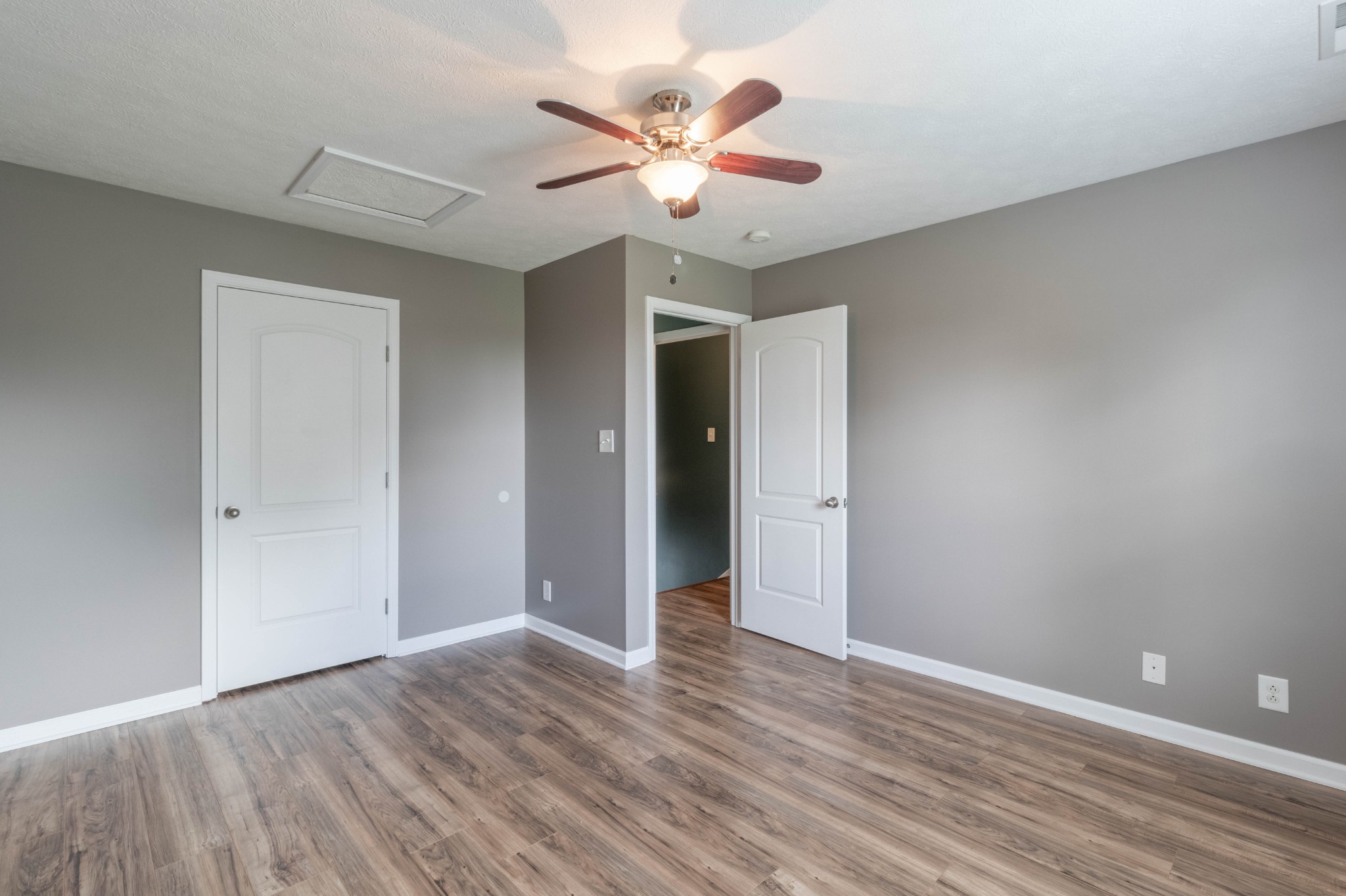 11241 Bell Station Road Oak Grove, KY 42262 - Photo 22 of 33 a view of an empty room with wooden floor