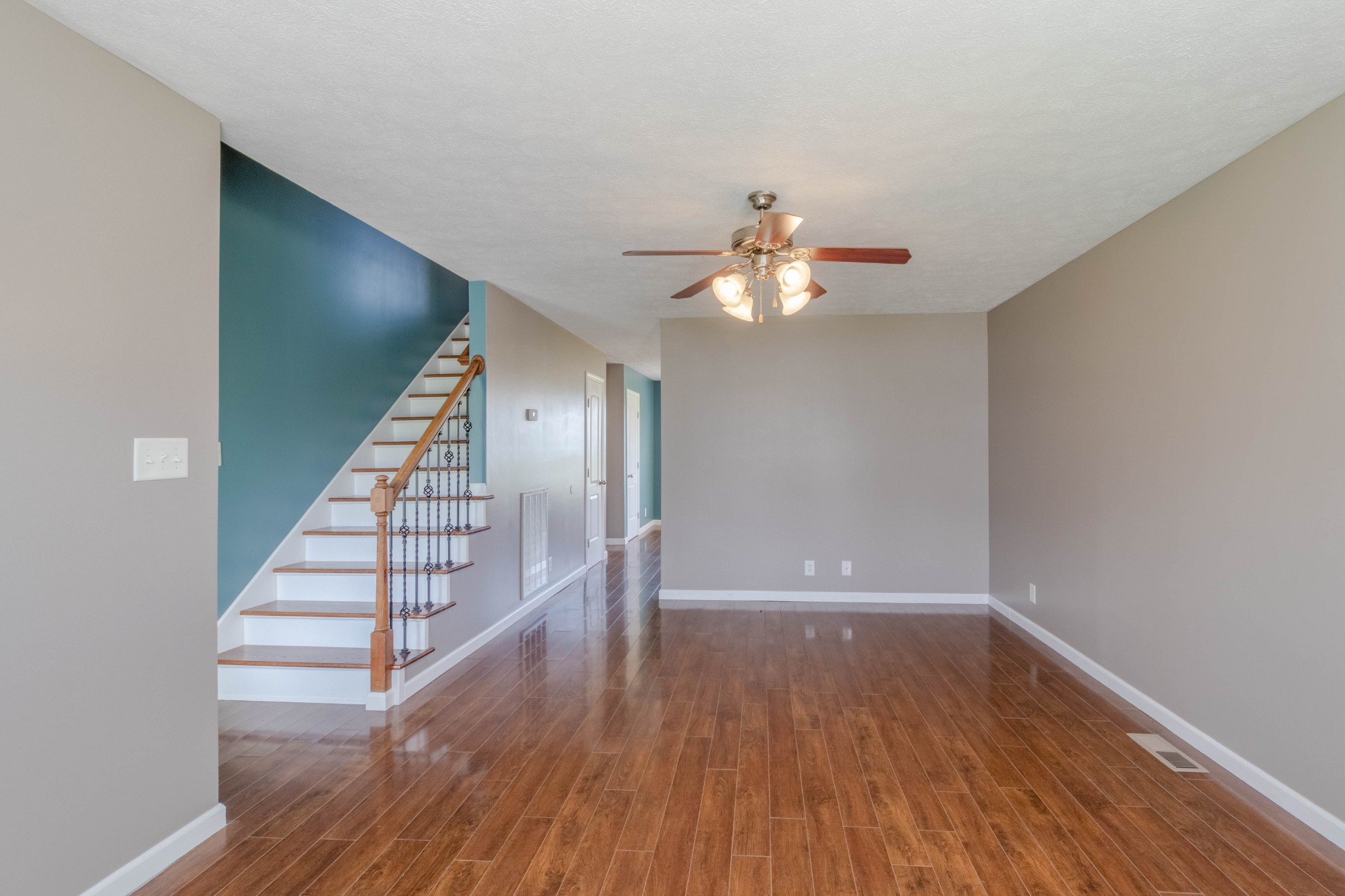 11241 Bell Station Road Oak Grove, KY 42262 - Photo 8 of 33 wooden floor in an empty room with a chandelier