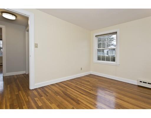 1095 Bay Road Sharon, MA 02067 - Photo 5 of 30 an empty room with wooden floor and windows