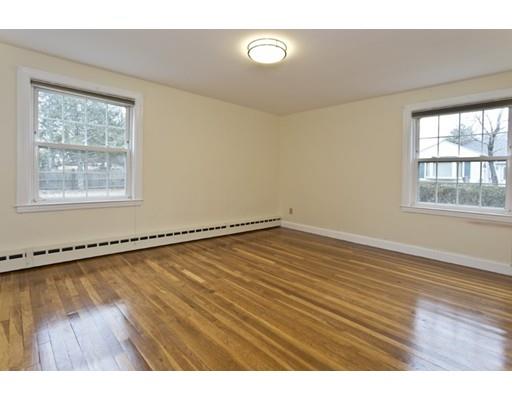 1095 Bay Road Sharon, MA 02067 - Photo 6 of 30 a view of an empty room with wooden floor and a window