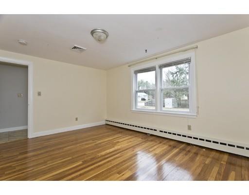 1095 Bay Road Sharon, MA 02067 - Photo 9 of 30 a view of an empty room with wooden floor and a window