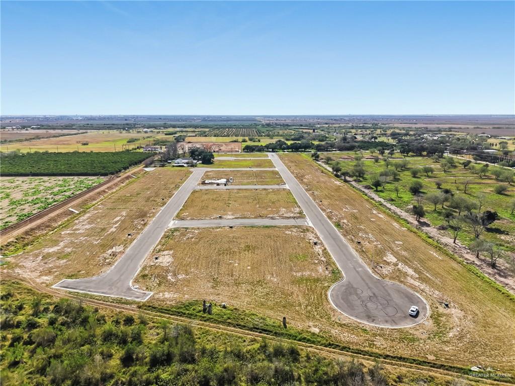 42 Pear Street Weslaco, TX 78596 - Photo 5 of 6 a view of swimming pool with a yard
