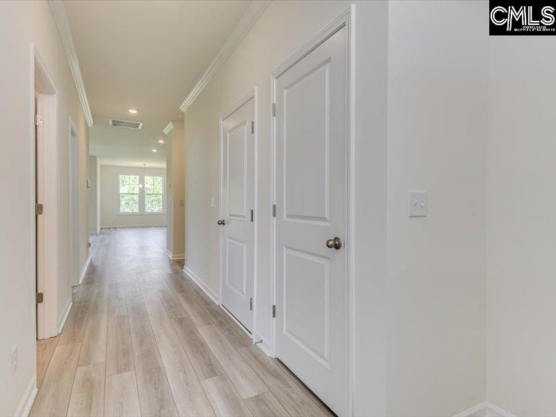628 Old Charleston Road Pelion, SC 29123 - Photo 7 of 36 a view of a hallway with wooden floor