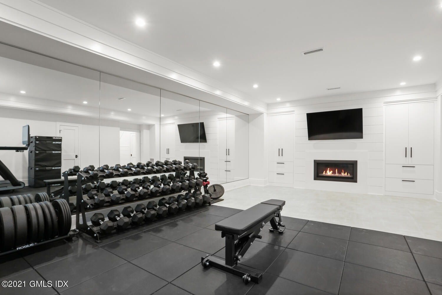 11 Anthony Place Riverside, CT 06878 - Photo 23 of 29 a living room with furniture a flat screen tv and a fireplace