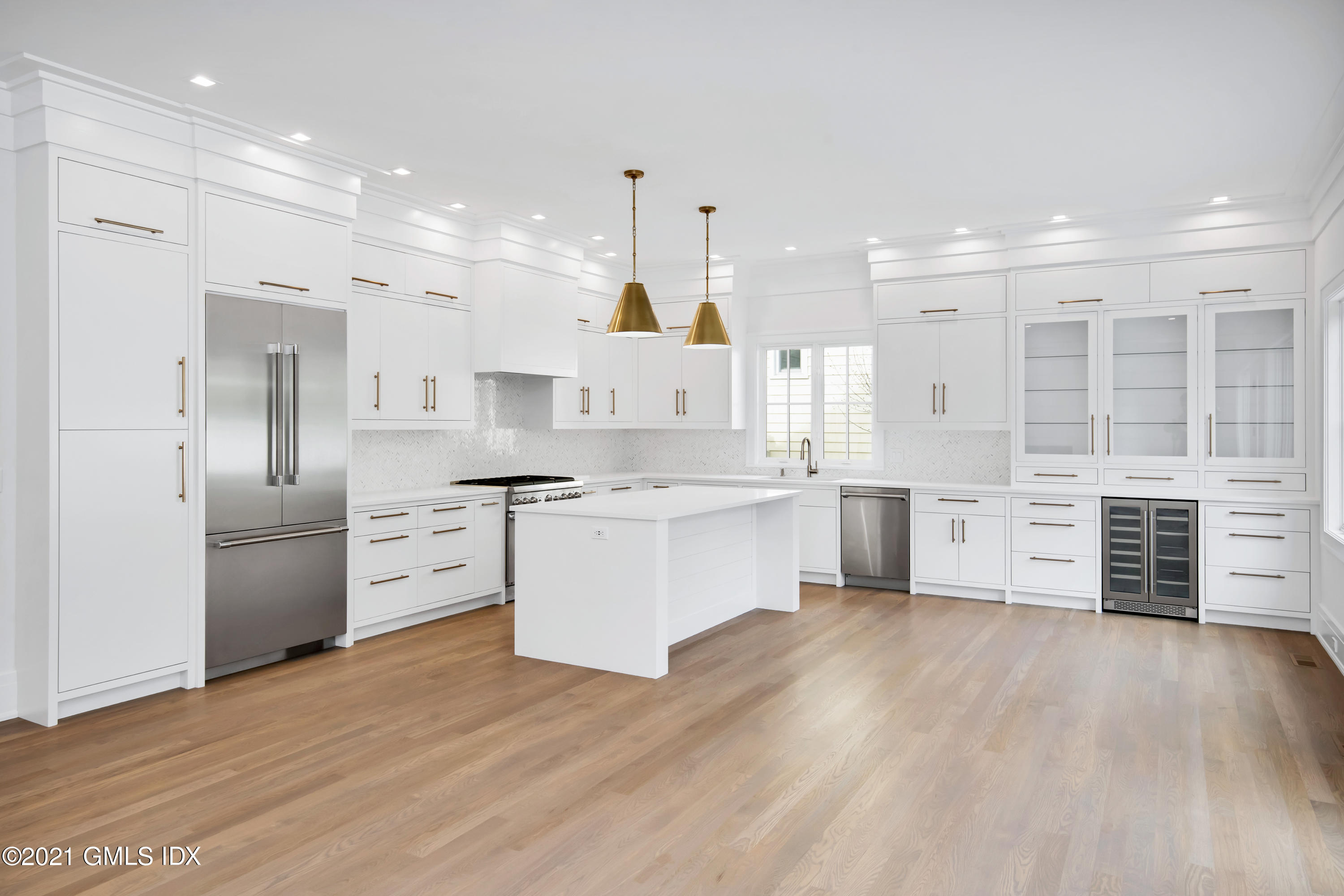 11 Anthony Place Riverside, CT 06878 - Photo 6 of 29 a large kitchen with kitchen island a sink stainless steel appliances and cabinets