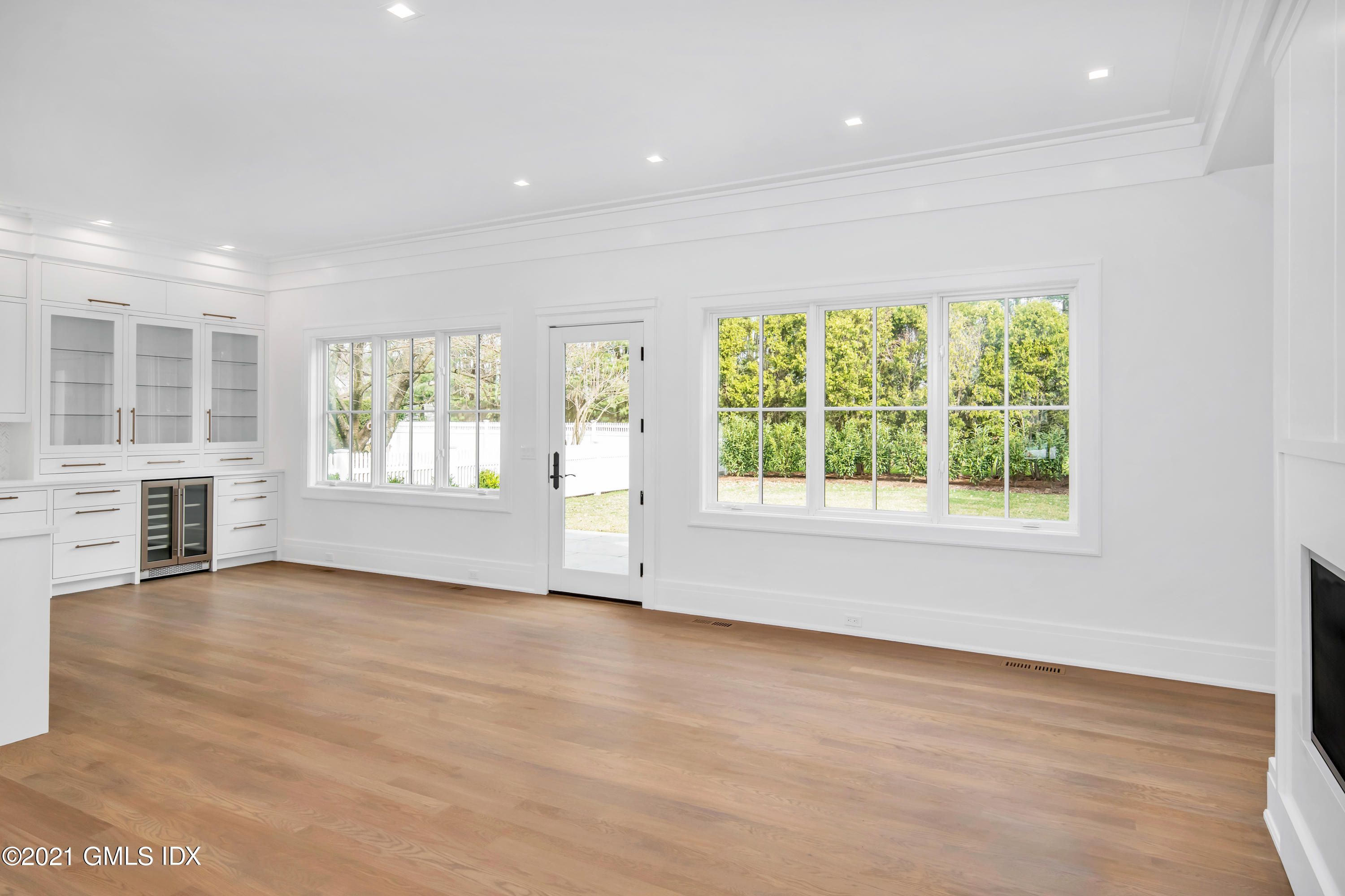 11 Anthony Place Riverside, CT 06878 - Photo 9 of 29 an empty room with wooden floor and windows