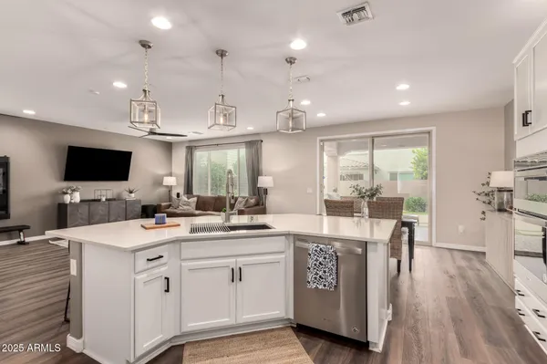 a kitchen with stainless steel appliances a refrigerator a stove and cabinets