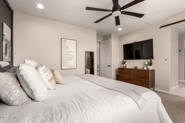 a bedroom with a bed and window
