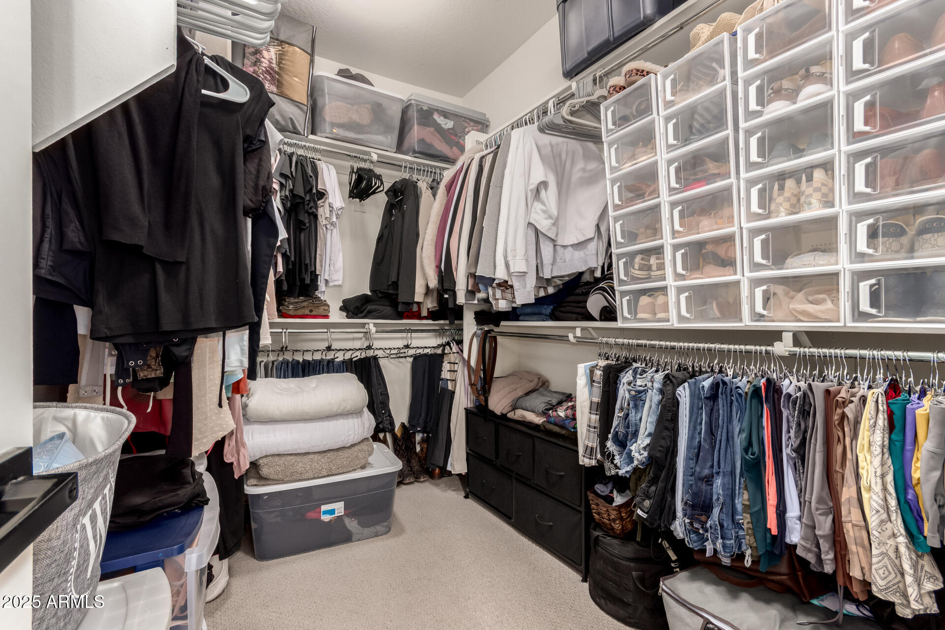 5418 South Vincent Mesa, AZ 85212 - Photo 25 of 38 a view of walk in closet with clothes and shoes