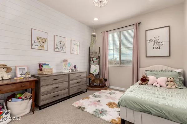 a bedroom with a bed and hallway