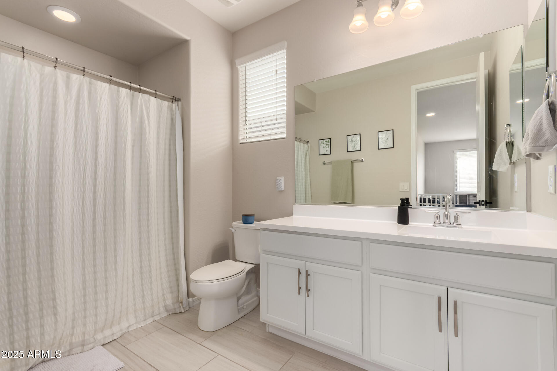 5418 South Vincent Mesa, AZ 85212 - Photo 31 of 38 a spacious bathroom with a double vanity sink toilet and a mirror