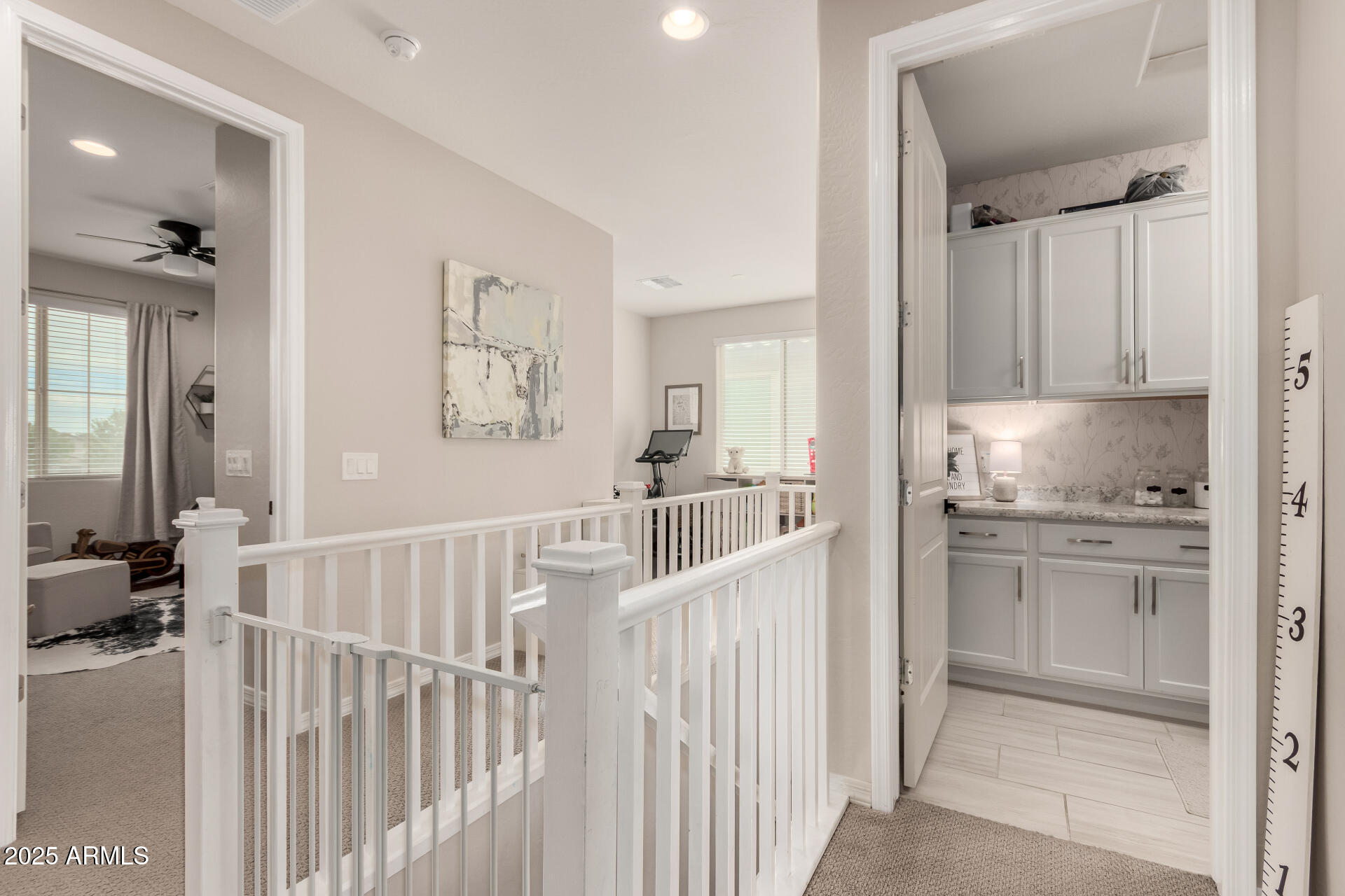 5418 South Vincent Mesa, AZ 85212 - Photo 32 of 38 a view of a hallway to a livingroom with furniture