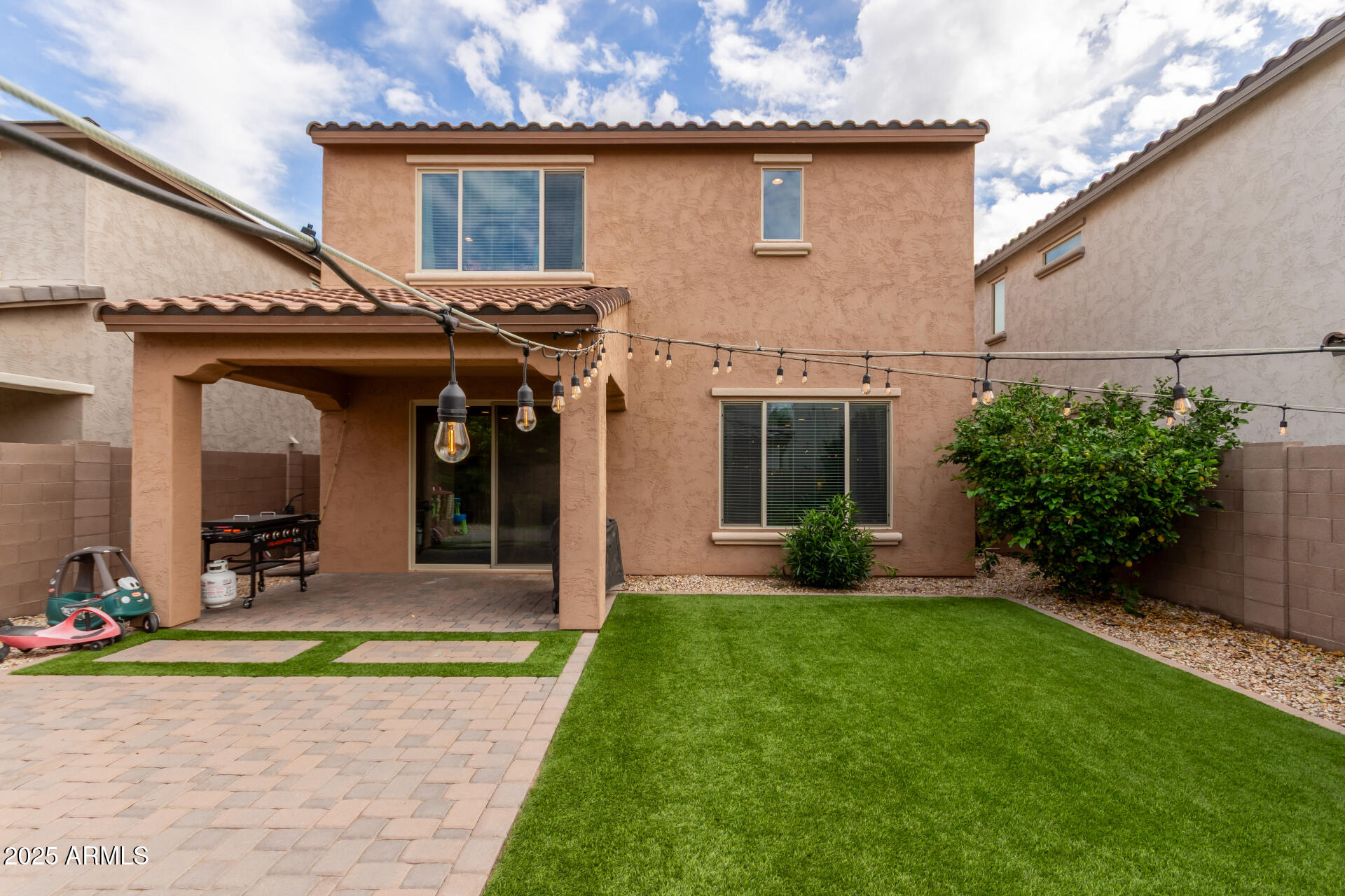5418 South Vincent Mesa, AZ 85212 - Photo 36 of 38 a view of a house with small yard plants and a large tree